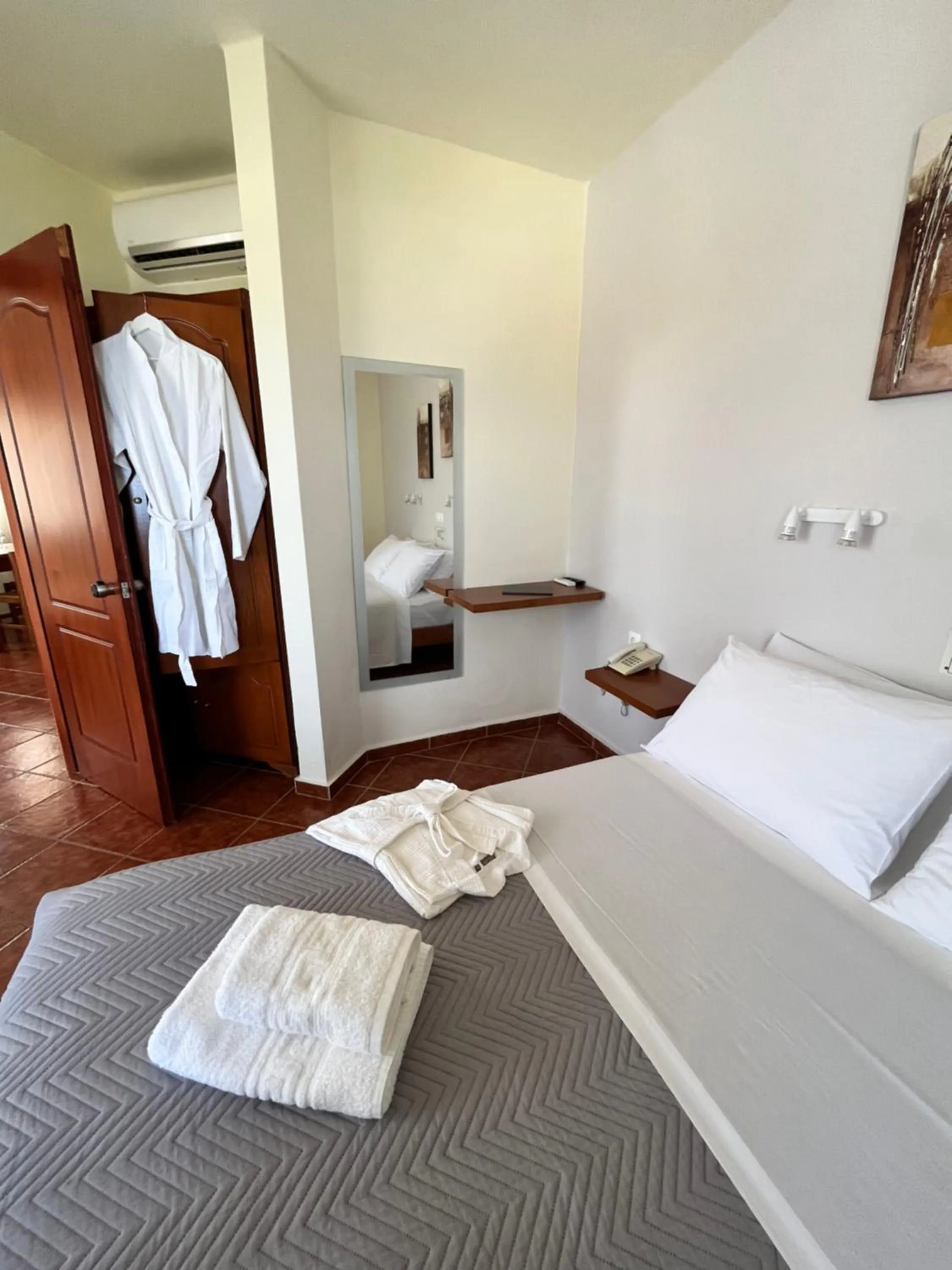 Bed in Iolkos Hotel Apartments