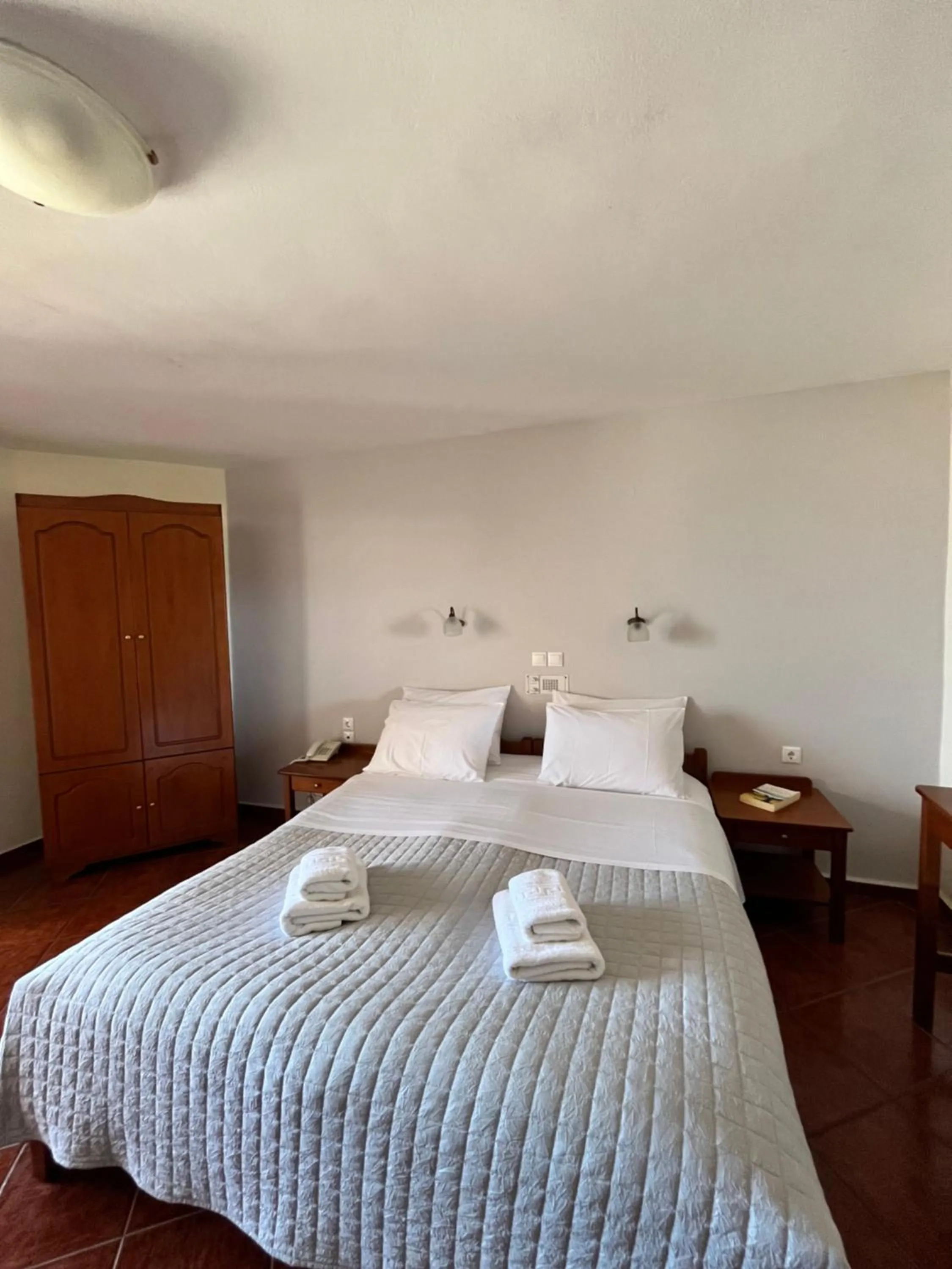 Bed in Iolkos Hotel Apartments