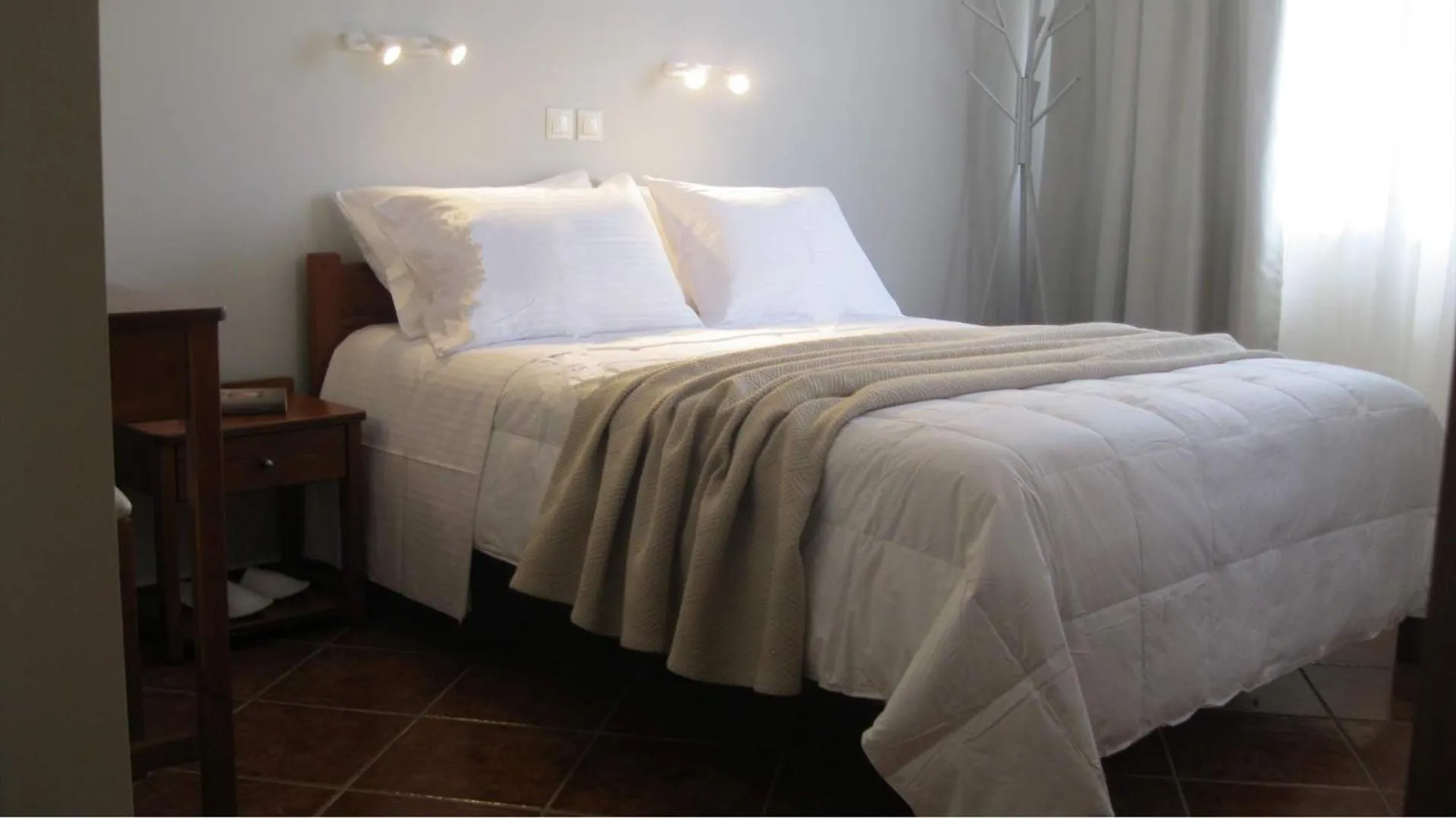 Bed in Iolkos Hotel Apartments