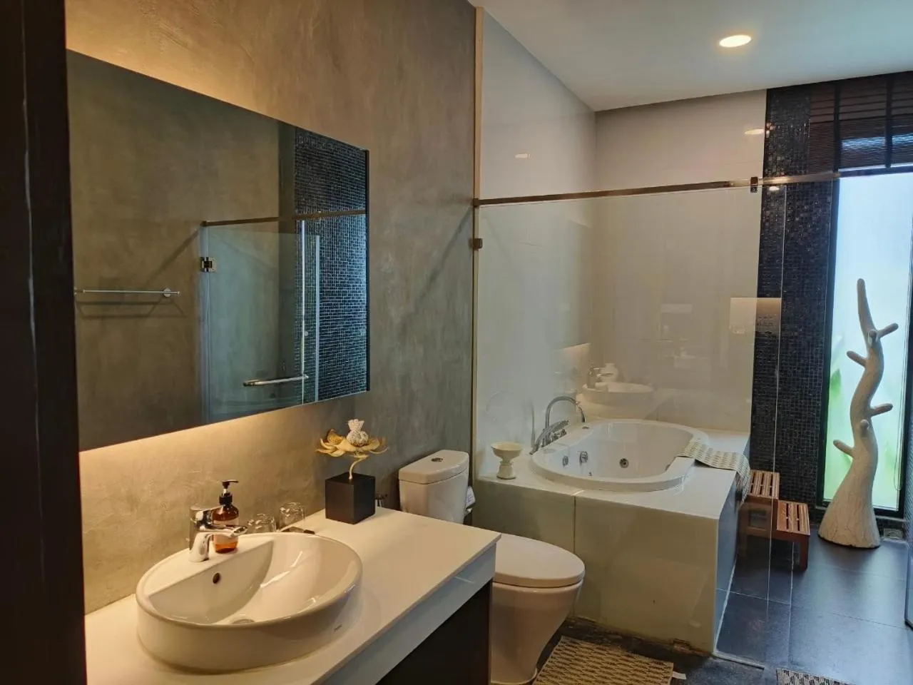 Bathroom in NAI YA Hotel -SHA Extra Plus