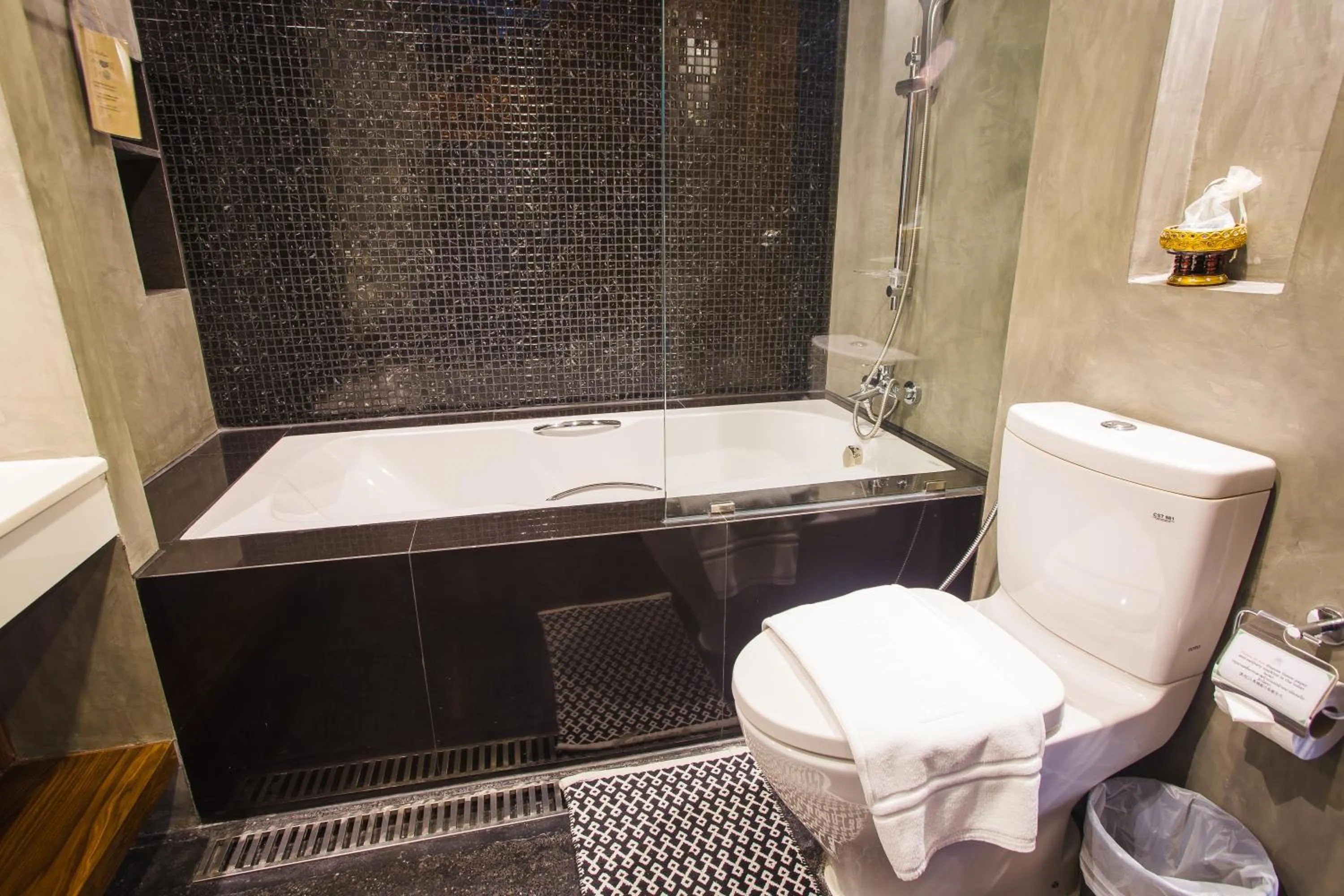 Bathroom in NAI YA Hotel -SHA Extra Plus