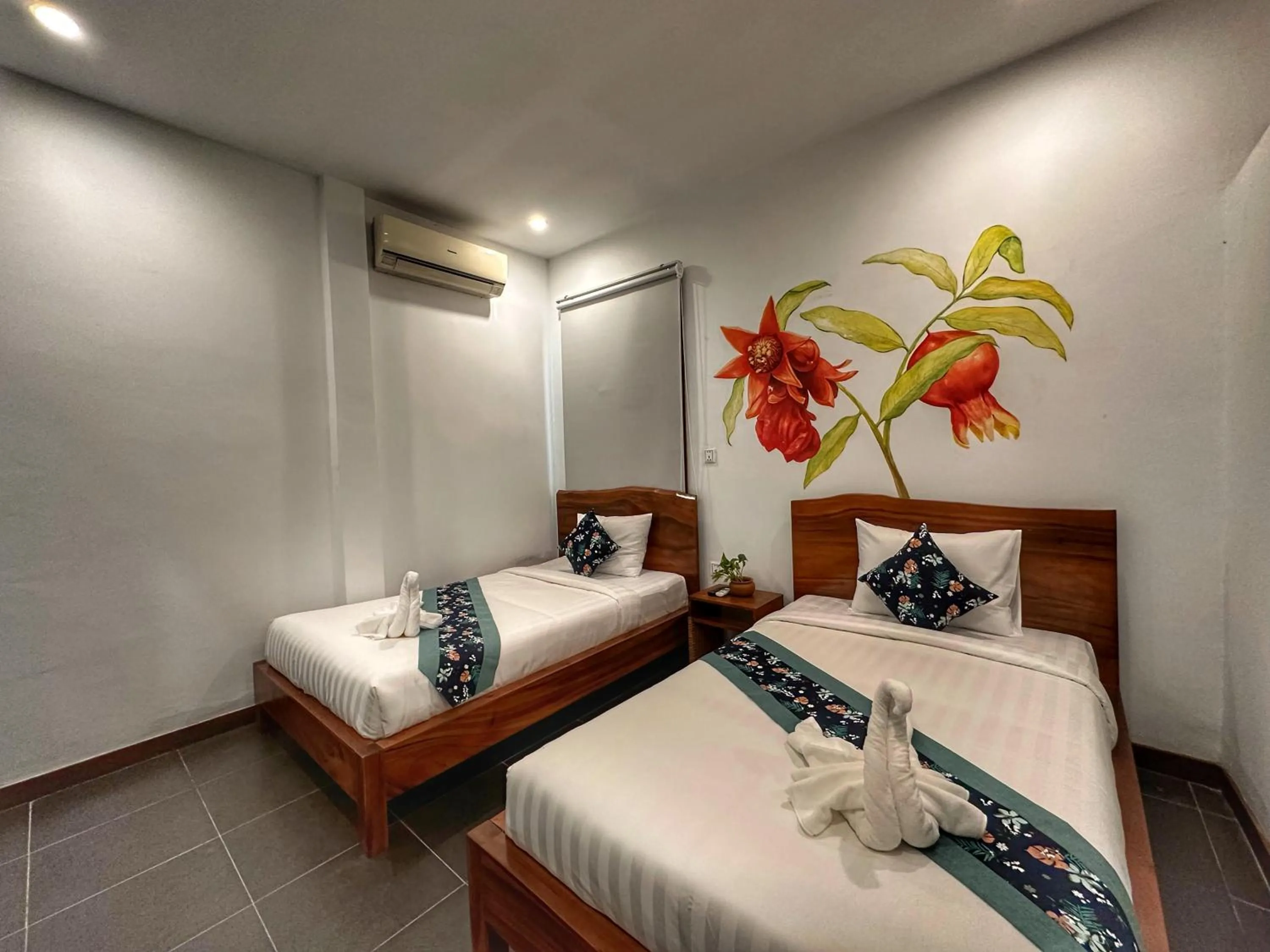 Bed in Monsoon Riverside Hotel