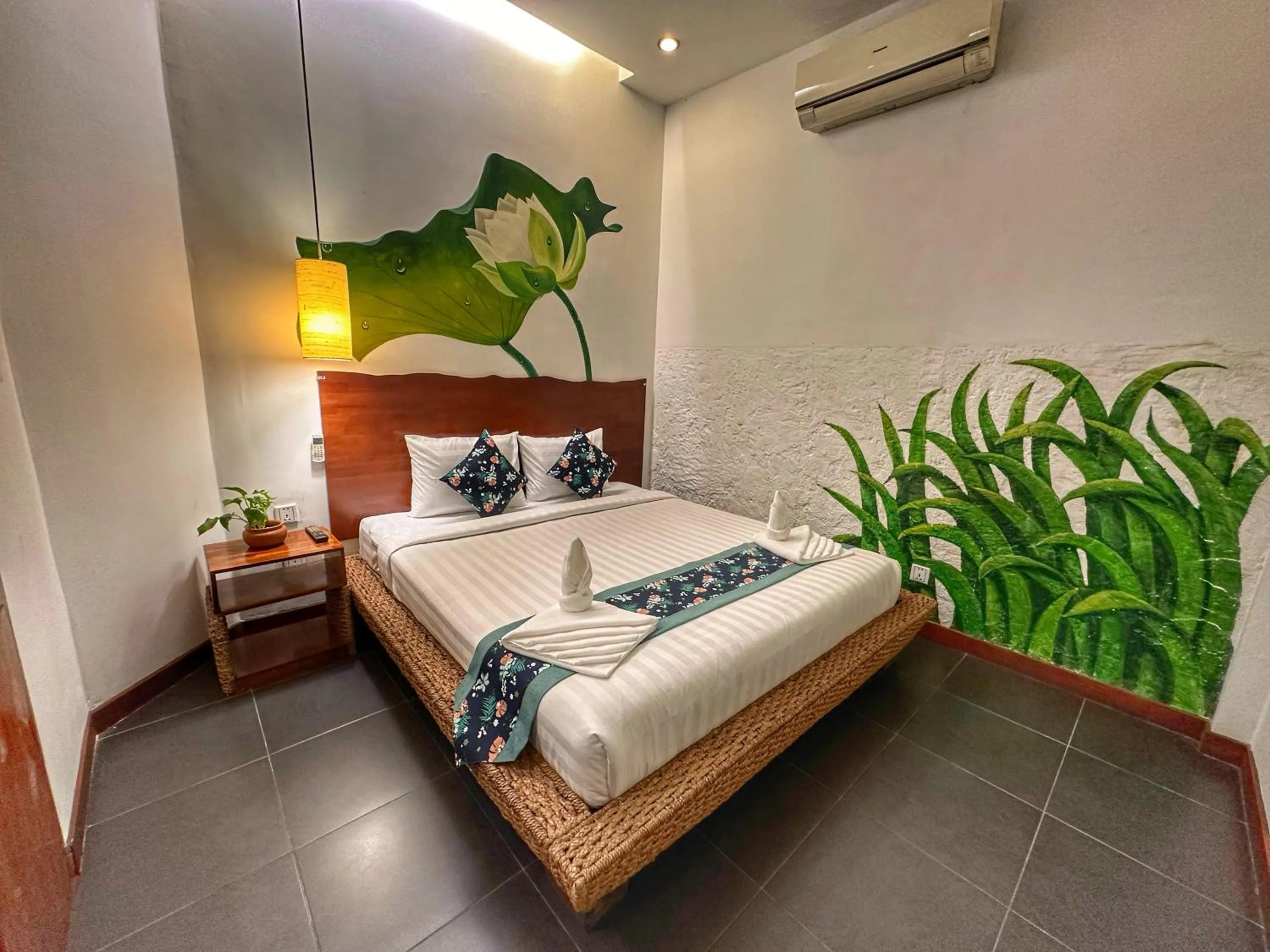 Bed in Monsoon Riverside Hotel