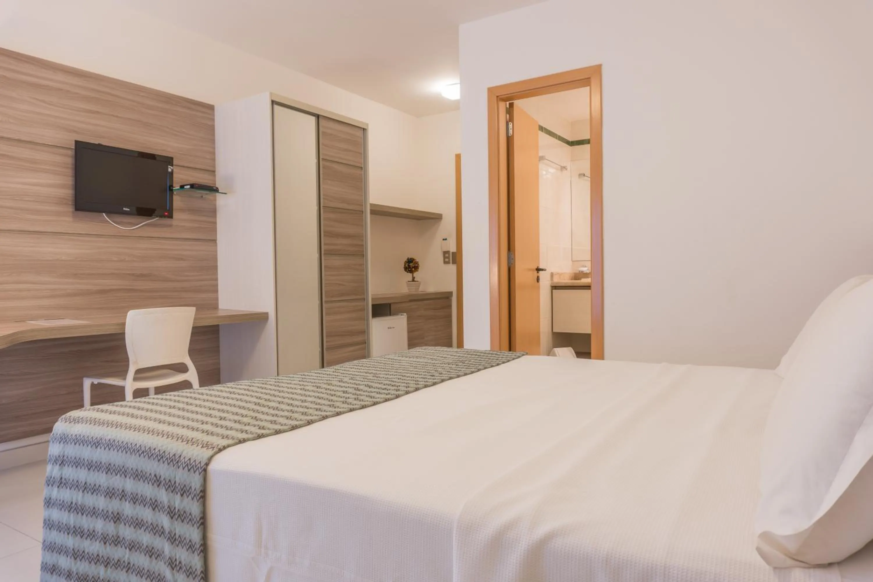 Seating area, Bed in Kristie Resort Natal Hotel