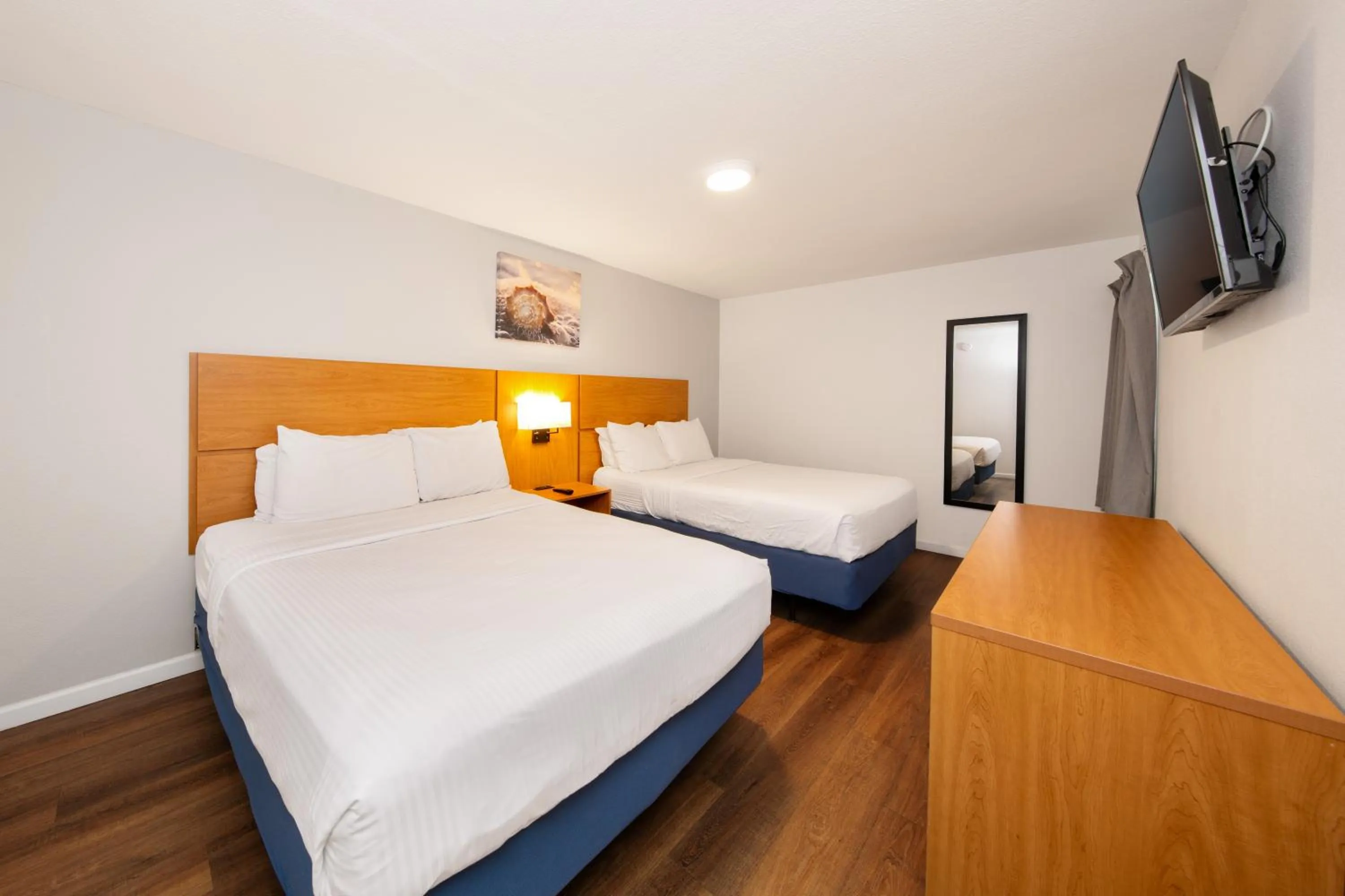 Bed in Chateau Beachfront Hotel, a By the Sea Resort