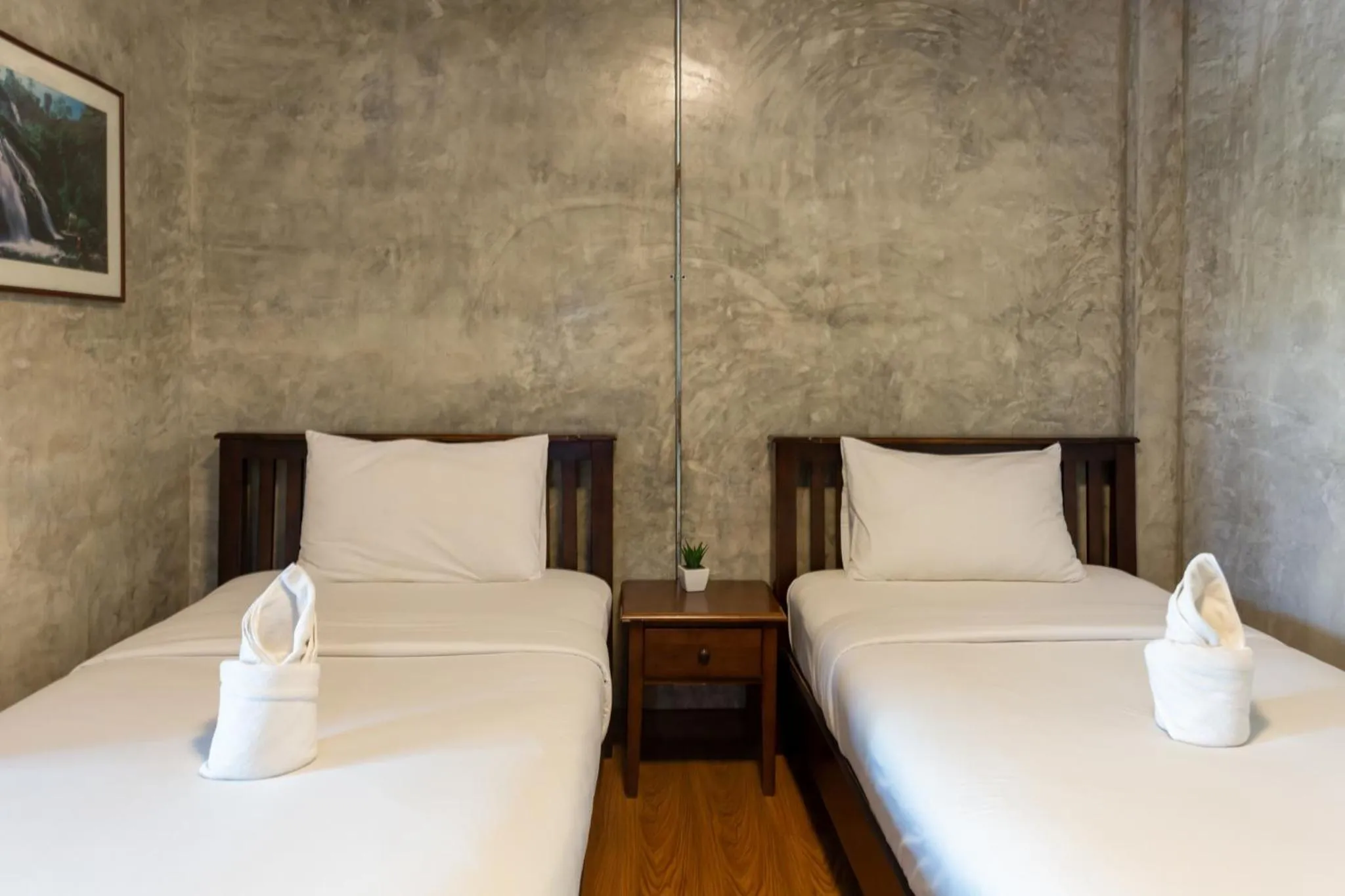 Bed in Baan Suan Ramita Resort