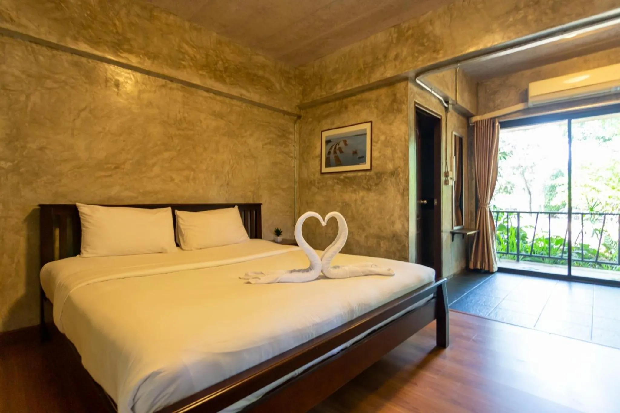 Bed in Baan Suan Ramita Resort