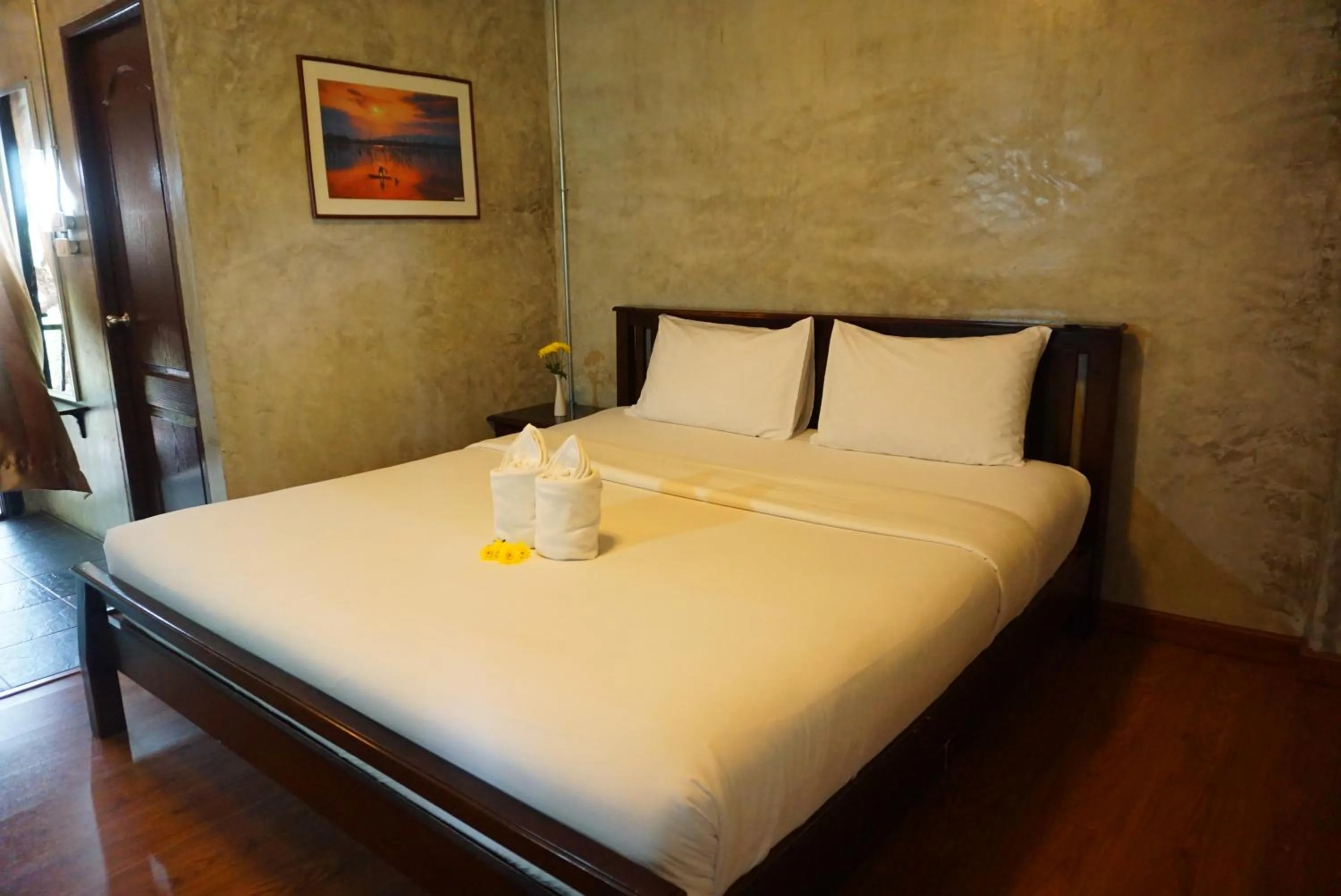 Bed in Baan Suan Ramita Resort
