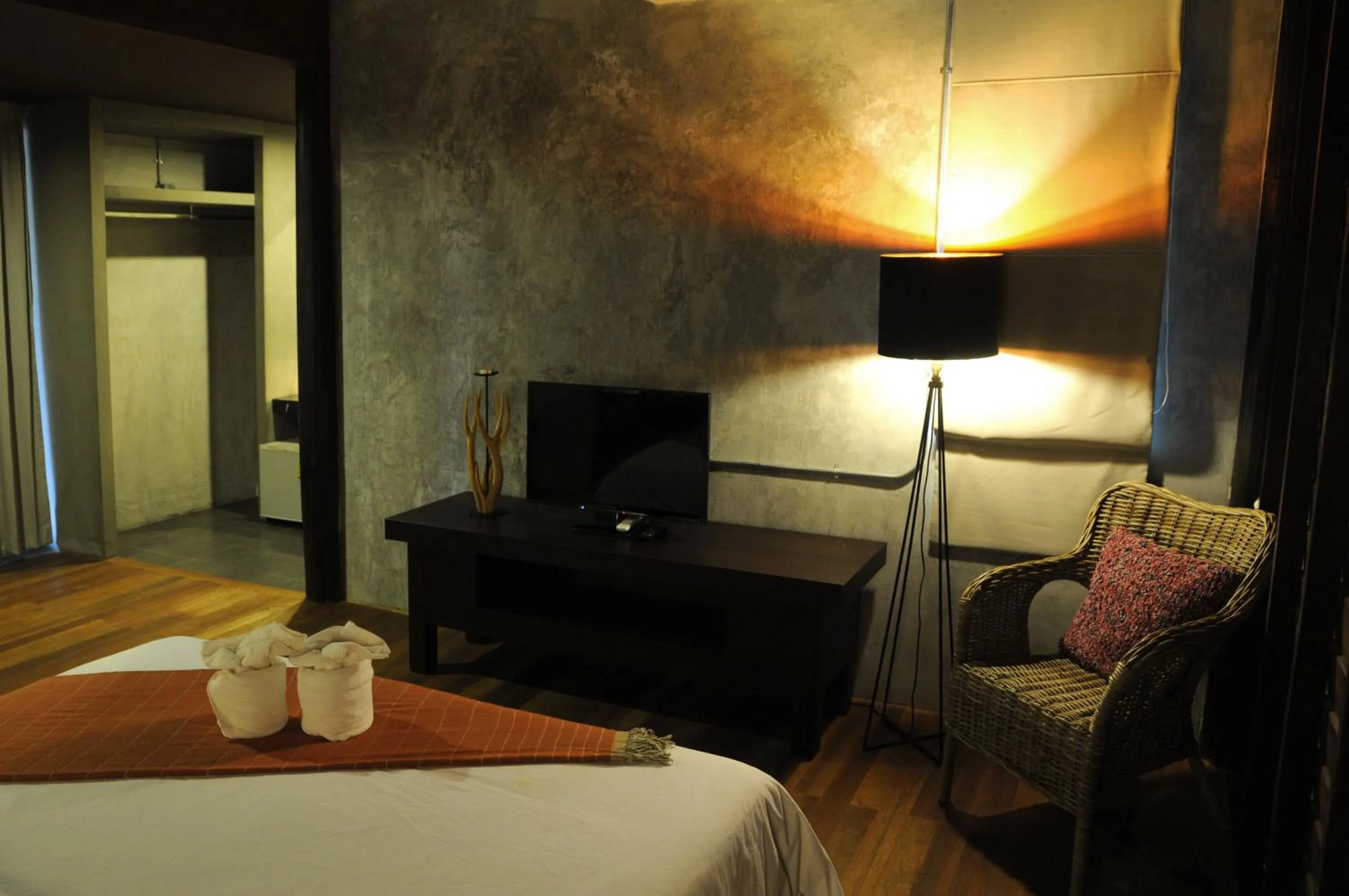 Bed in Baan Suan Ramita Resort