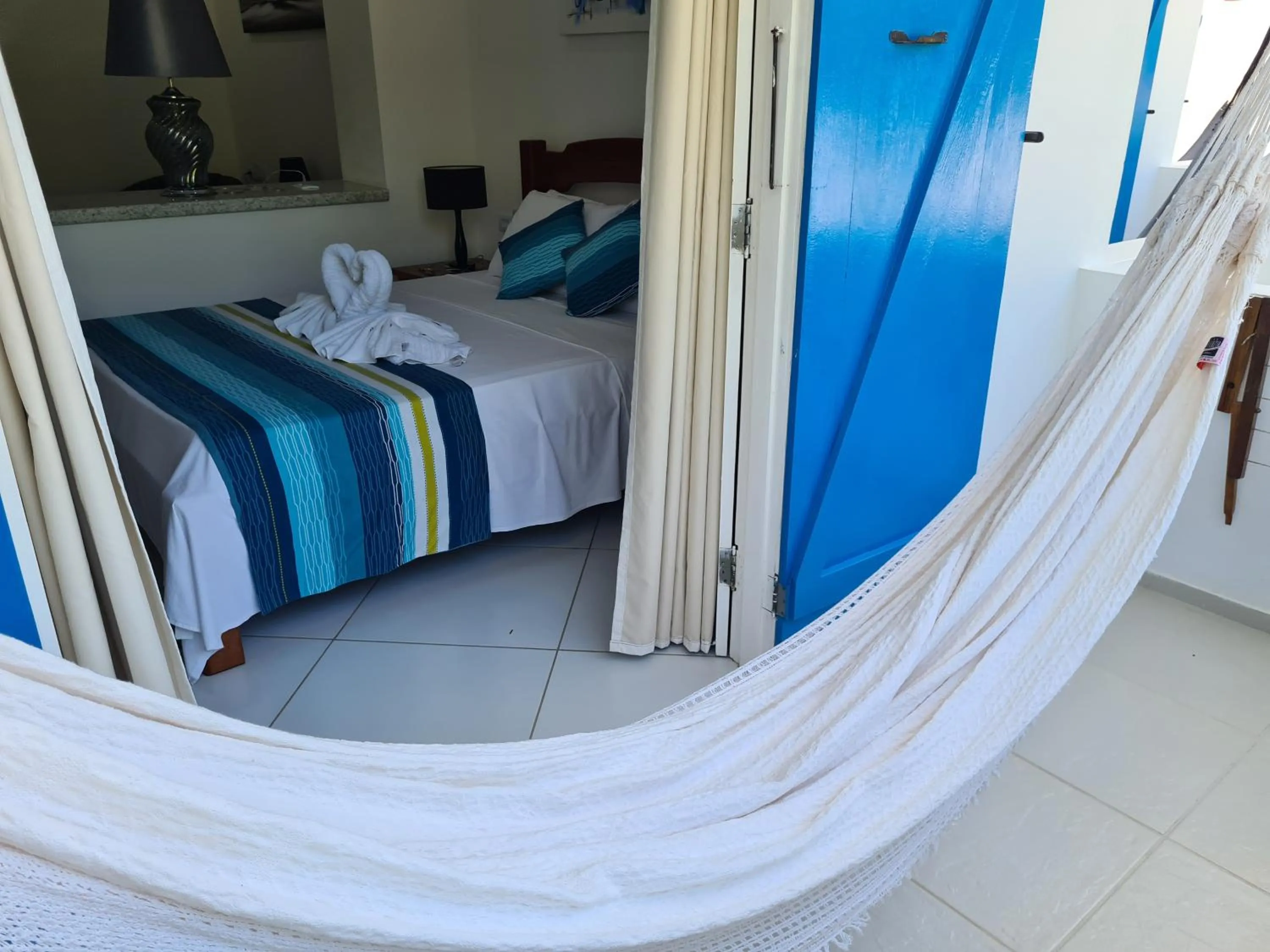 Bed in Pousada Caminho da Praia