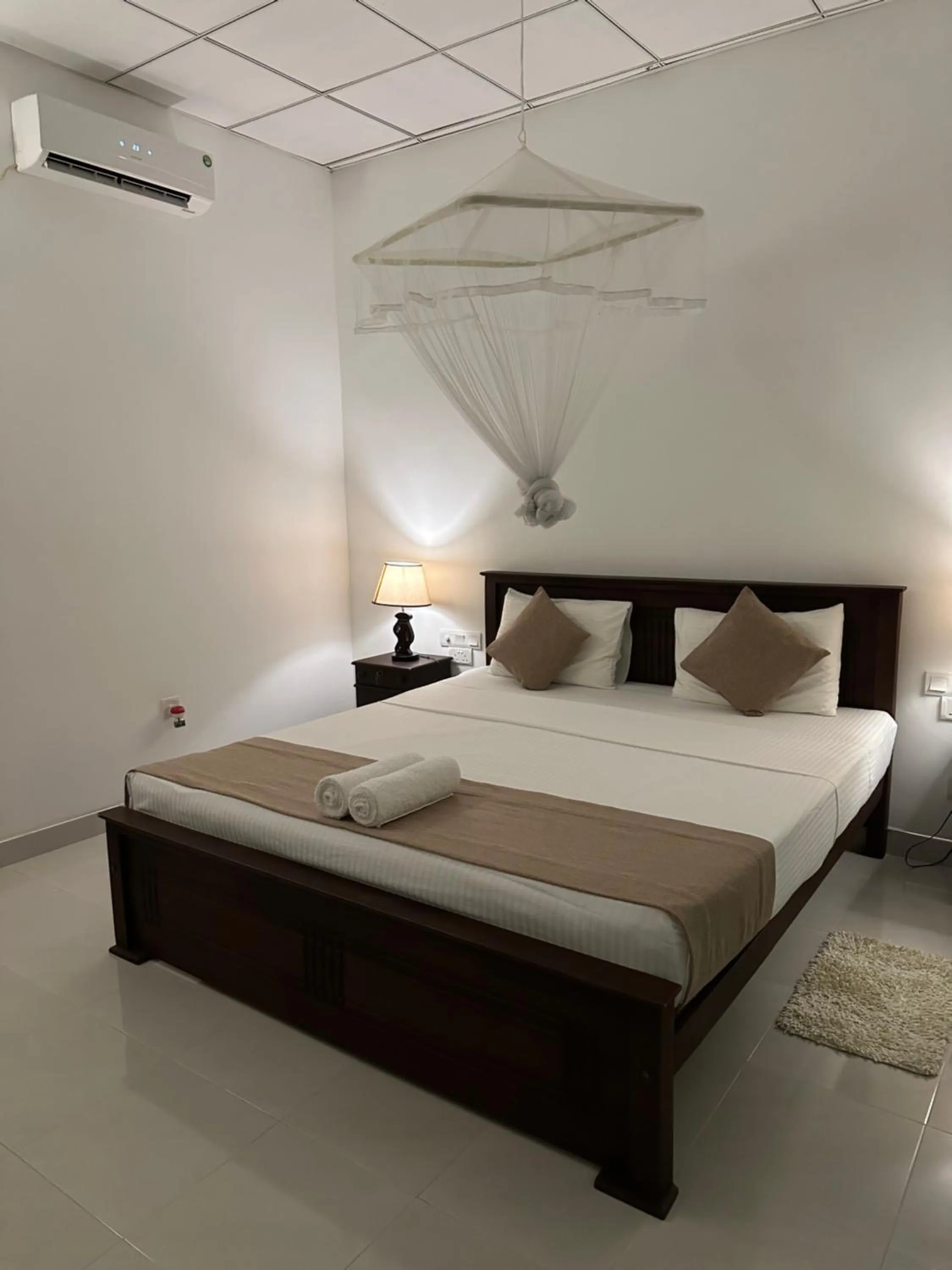 Bed in Sigiri Hibiscus Villa