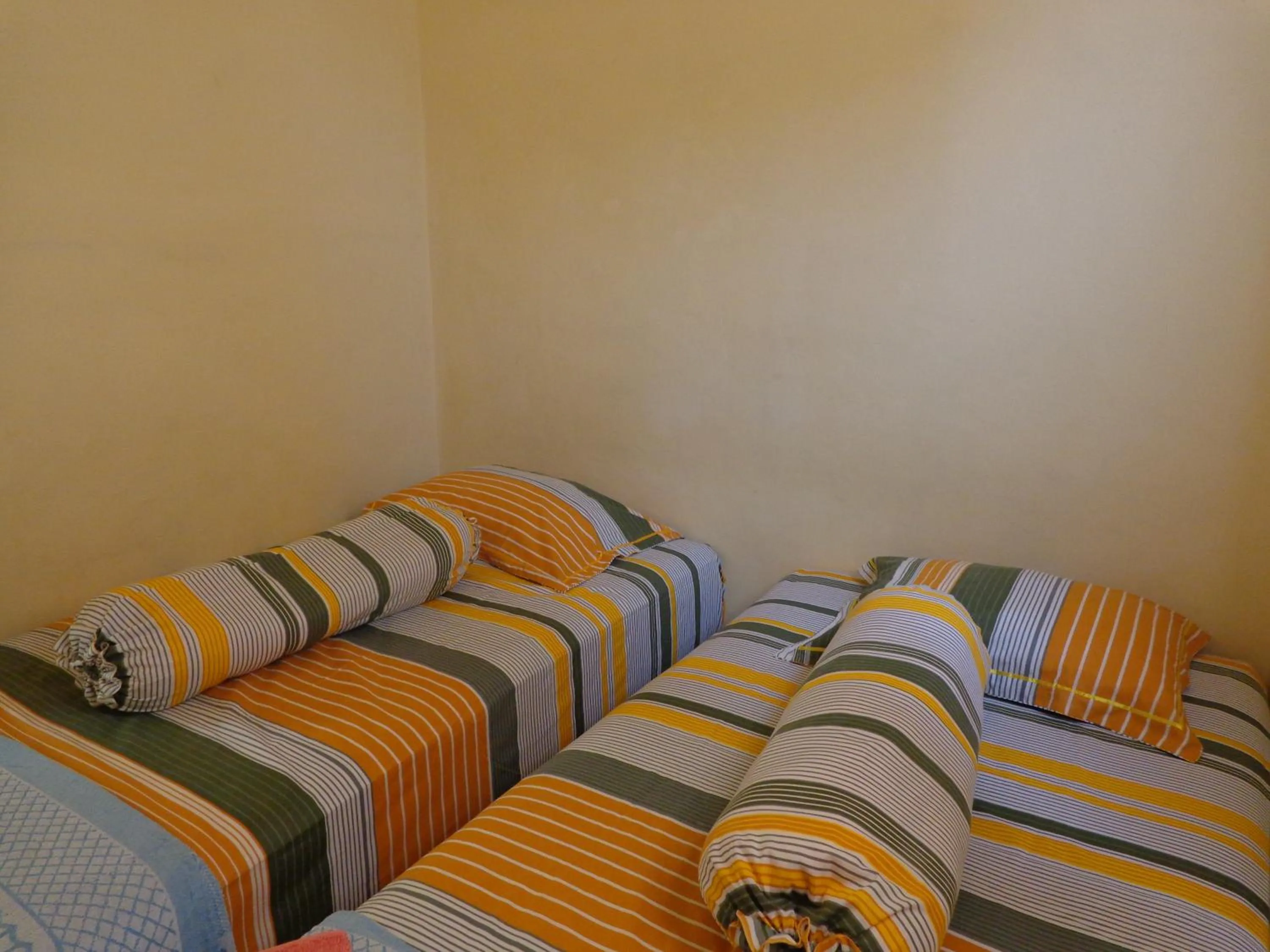 Bed in Hotel Musafir Inn