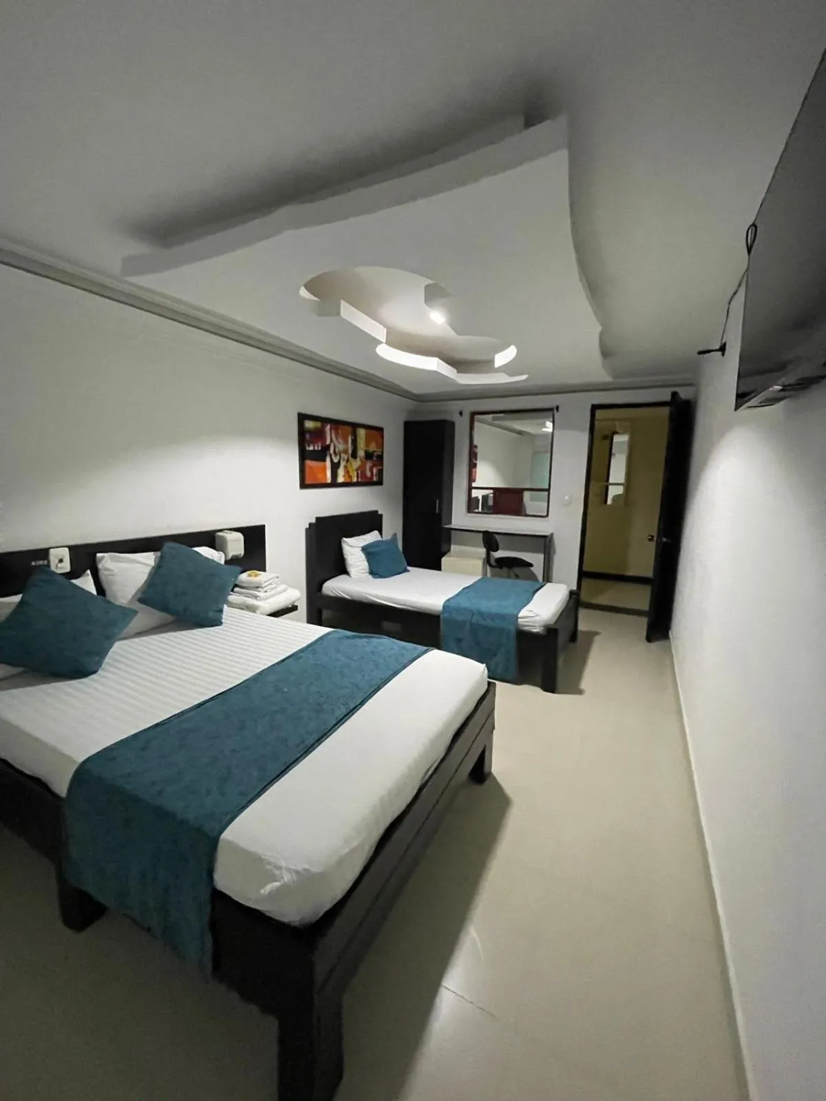 Communal lounge/ TV room, Bed in Hotel Plaza Norte Cali