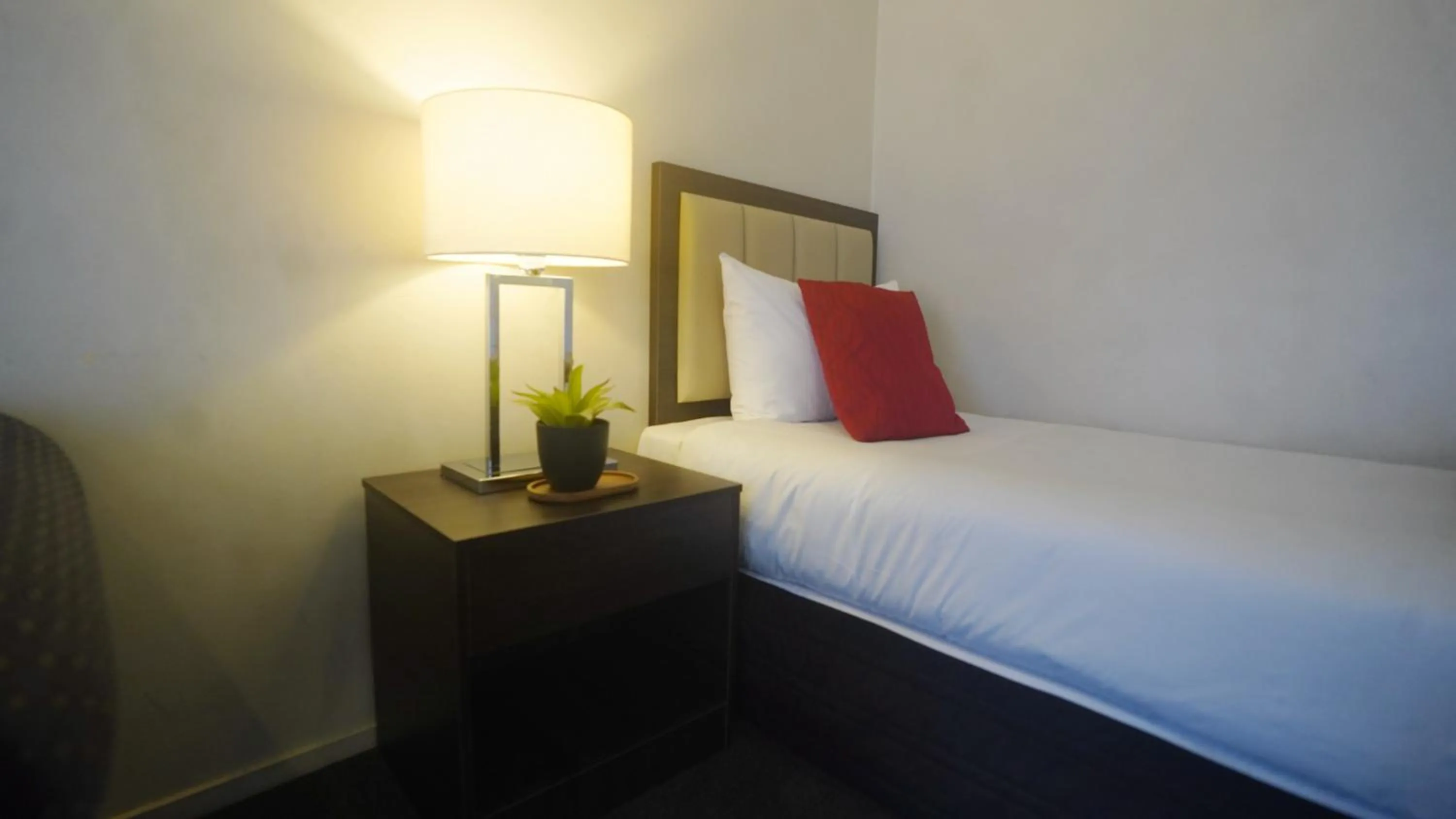 Bed in Abbey Motor Lodge