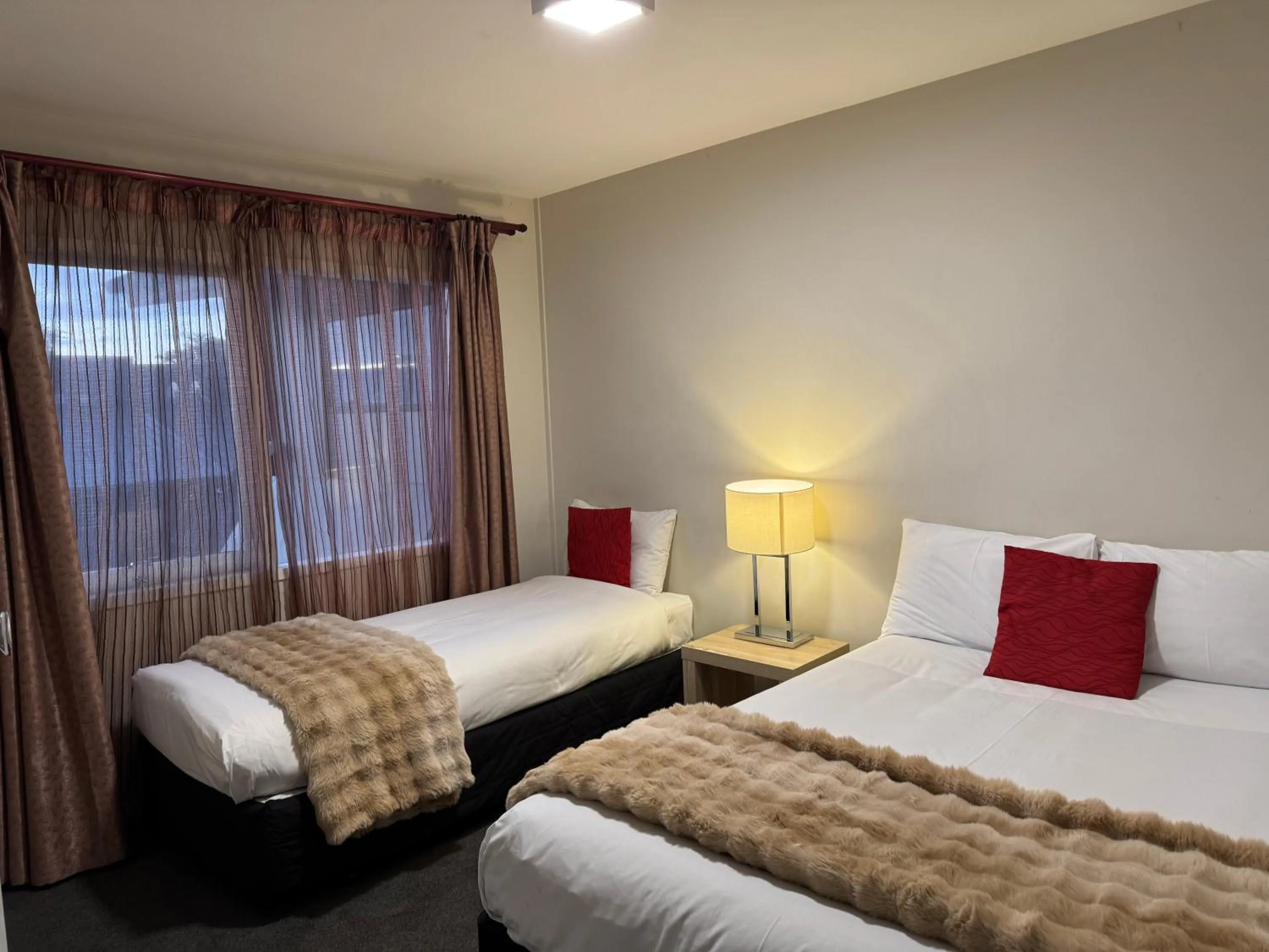 Bed in Abbey Motor Lodge