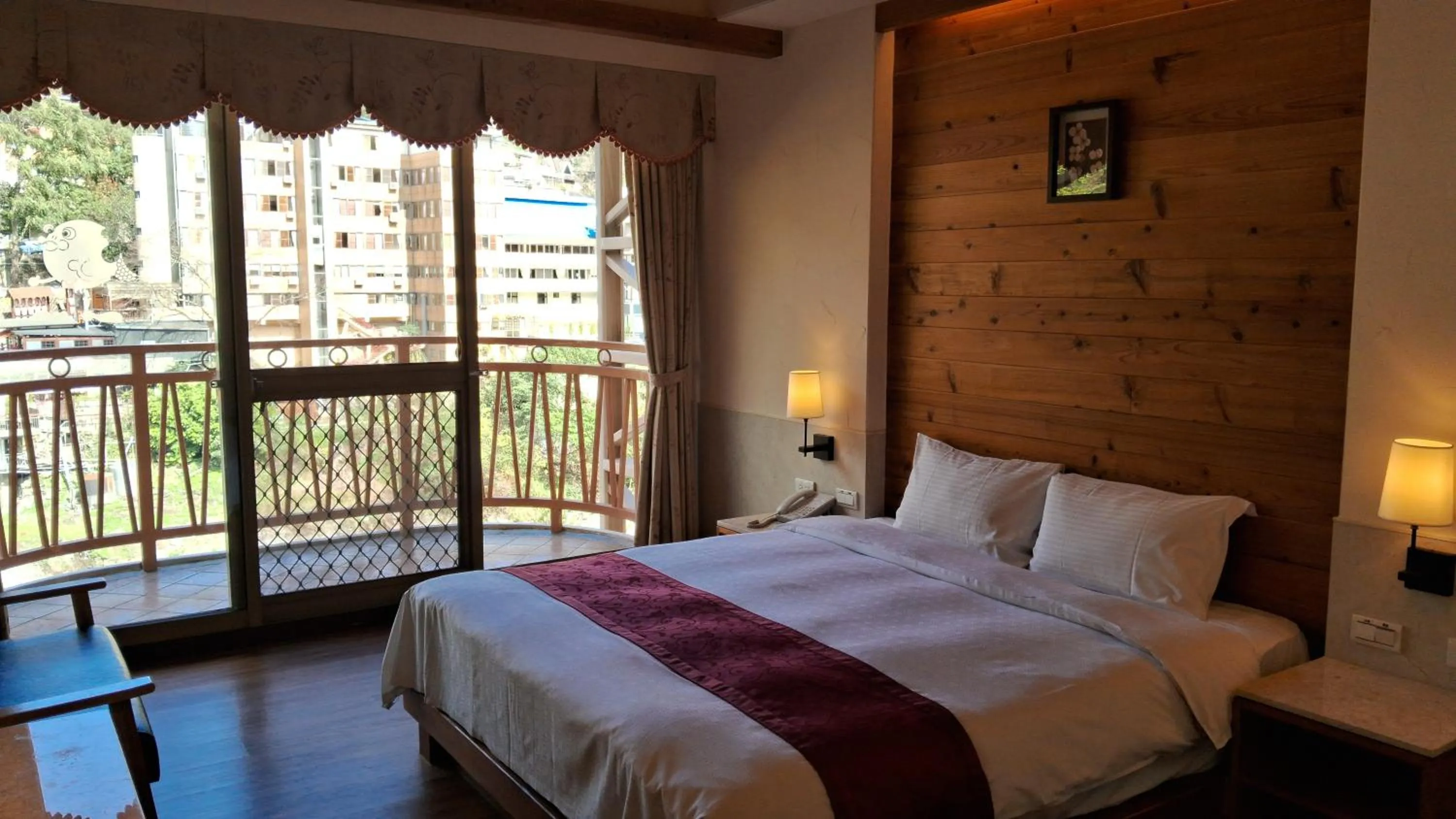 Bed in Ku Kuan Resort Hotel