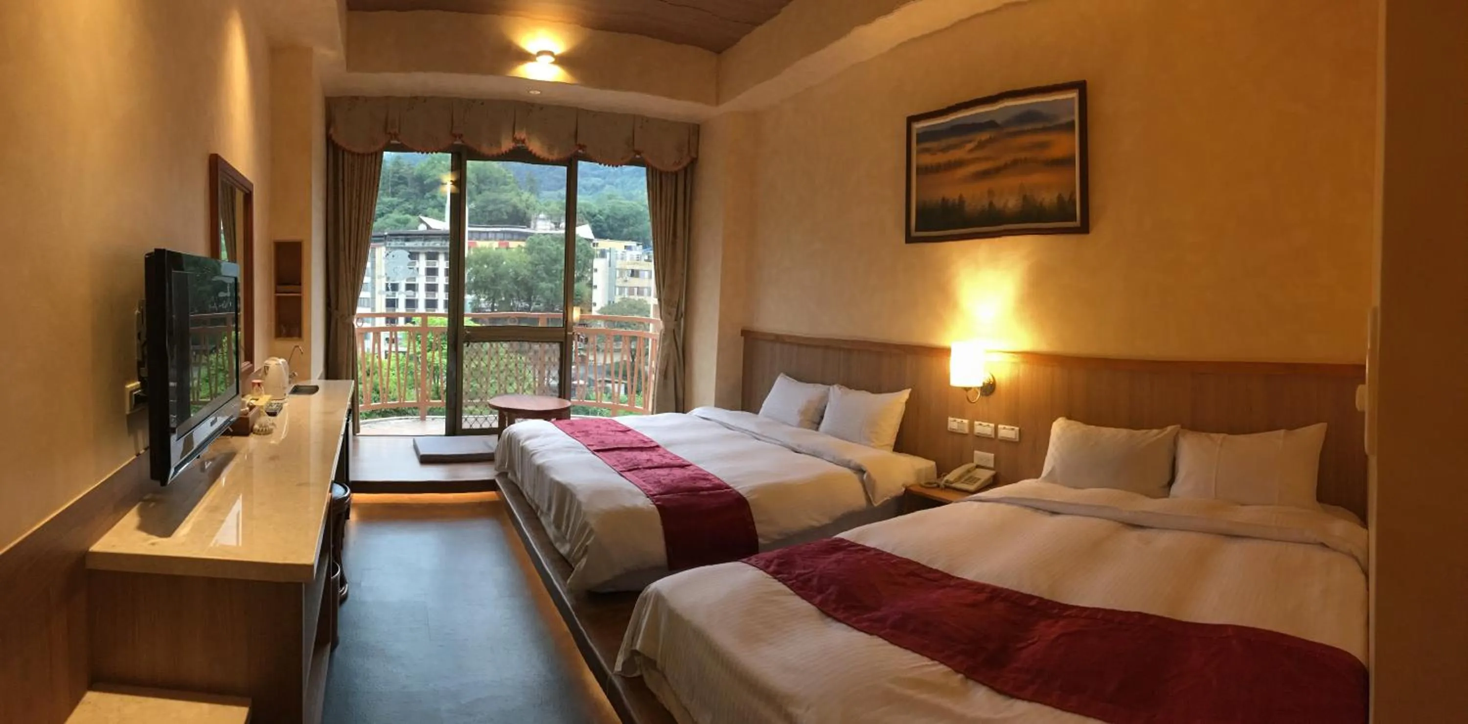 Bed in Ku Kuan Resort Hotel