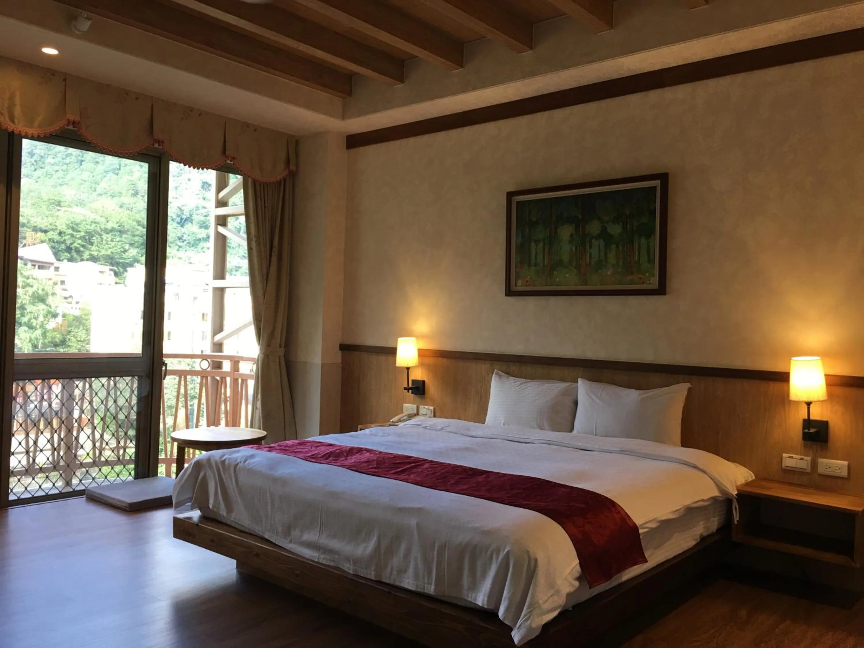 Bed in Ku Kuan Resort Hotel