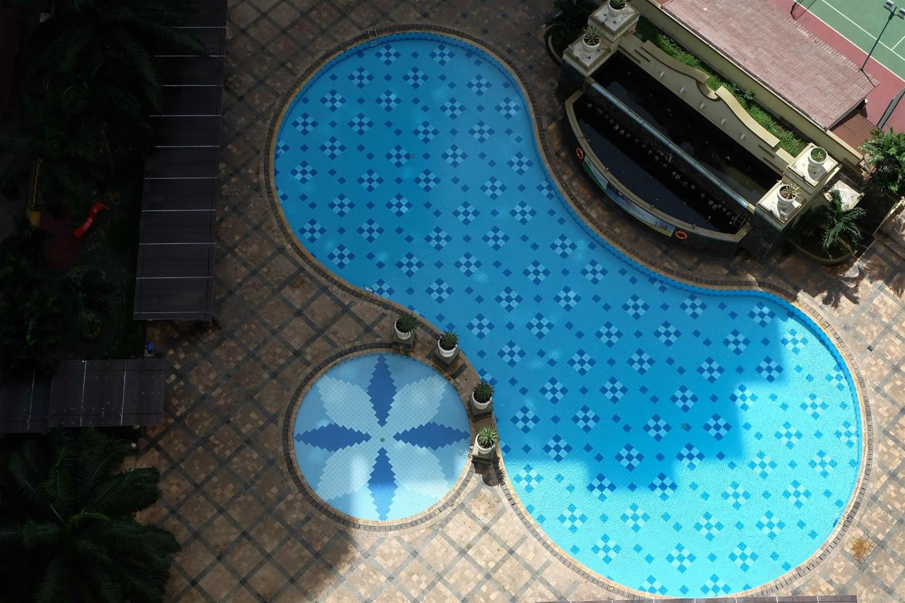 Swimming pool in 2BR Mediterania Palace Kemayoran Apartment By Travelio