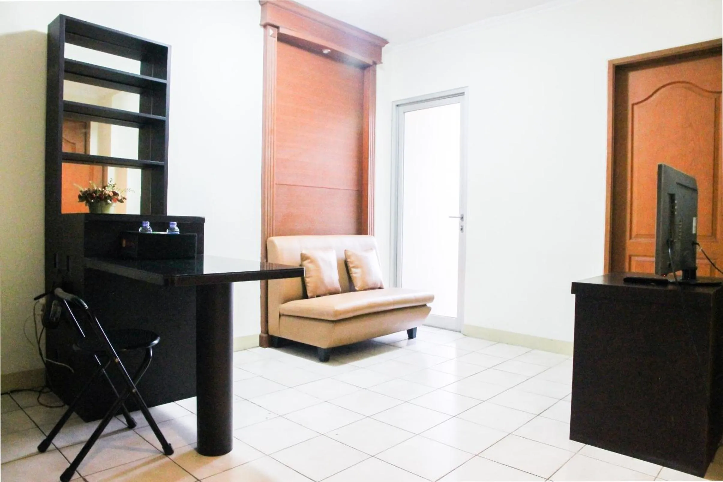 Living room in 2BR Mediterania Palace Kemayoran Apartment By Travelio