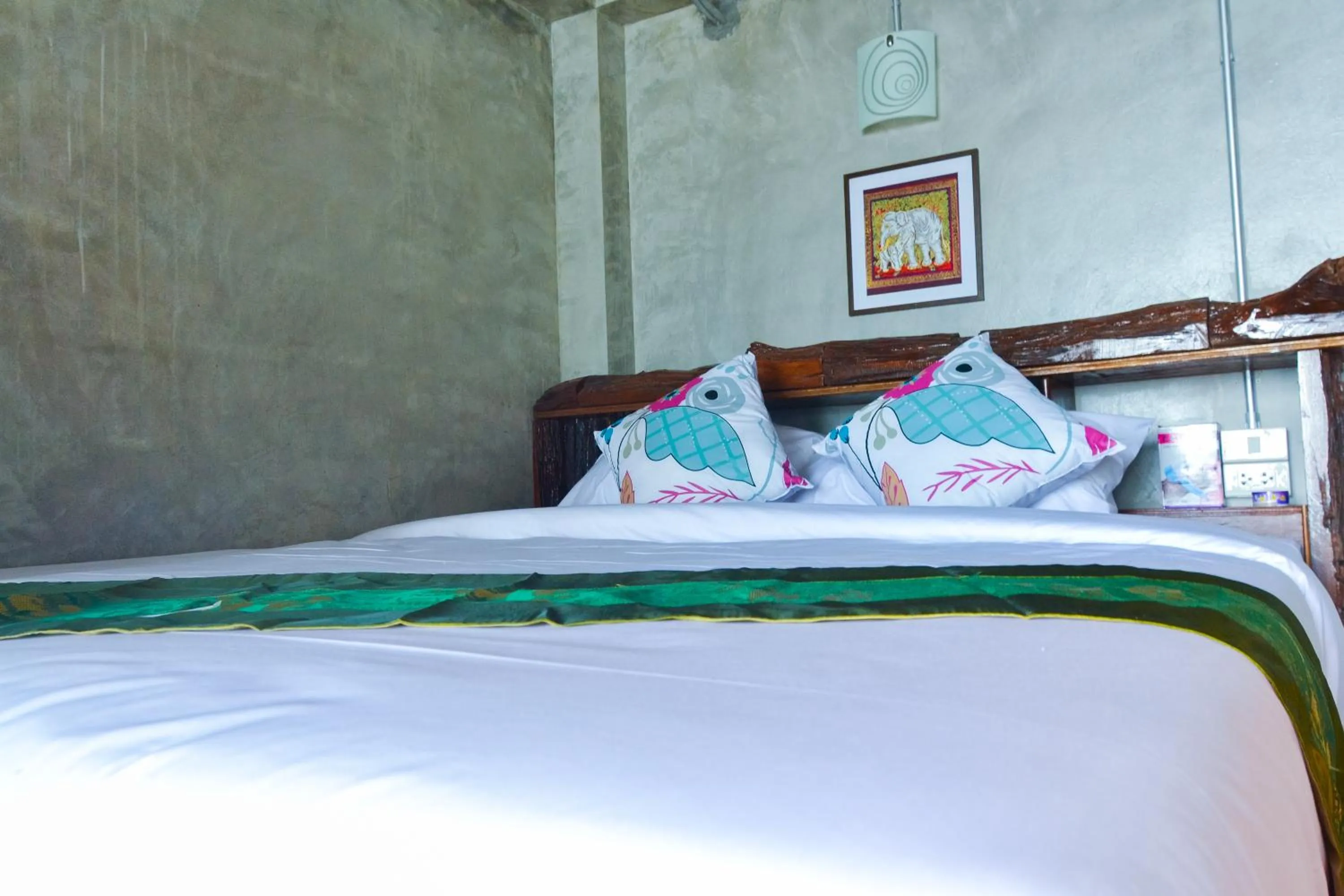 Bed in Baan Tubkaek Hotel