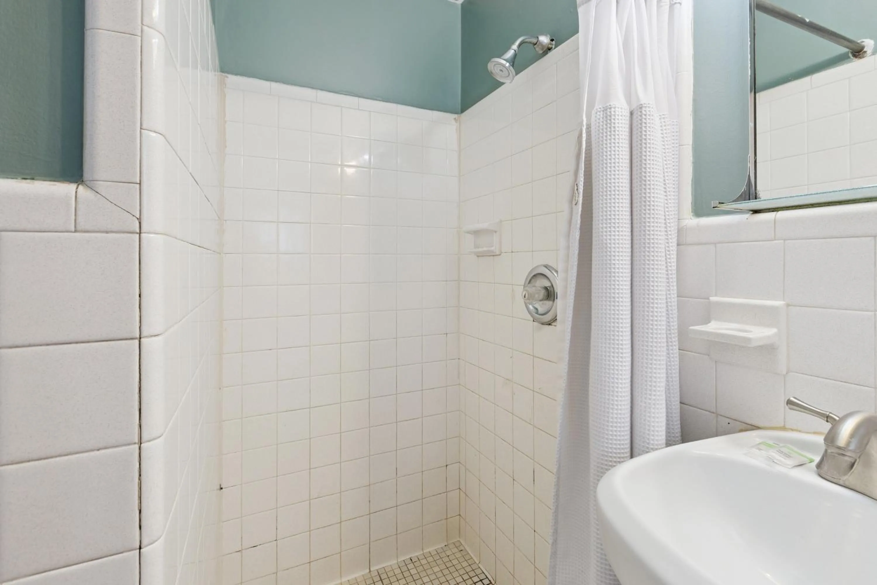 Bathroom in Currys Motel by OYO Saginaw MI