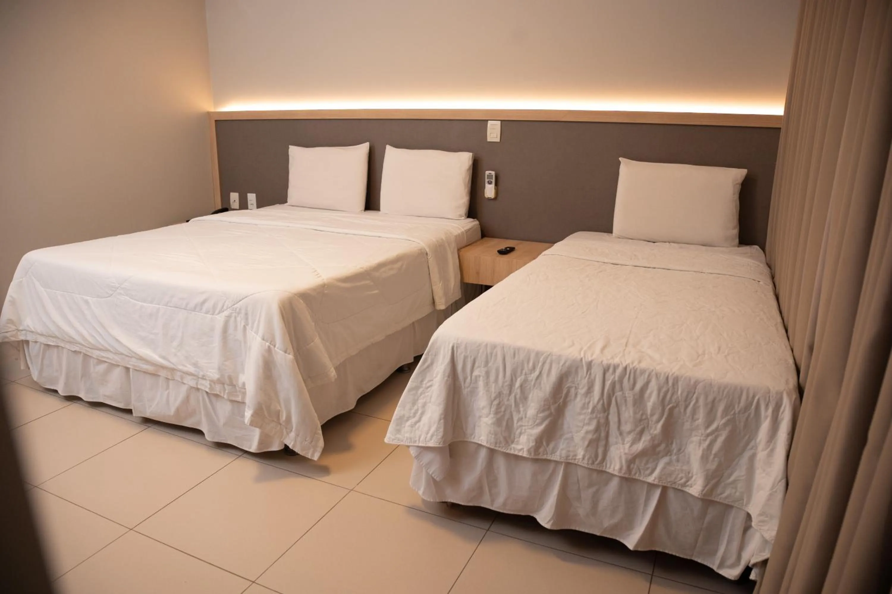 Bed in Golden Plaza Hotel