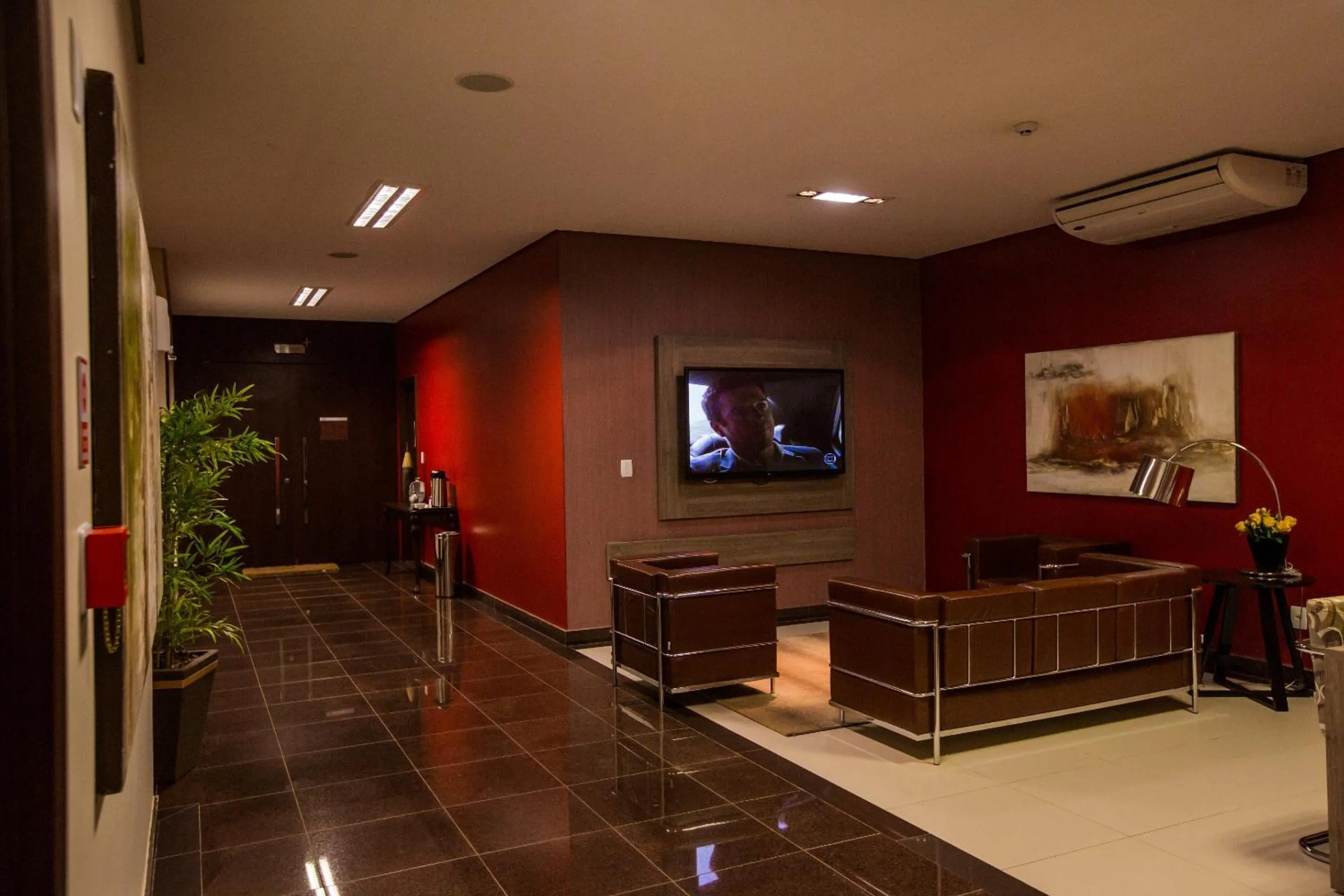 Communal lounge/ TV room in Golden Plaza Hotel