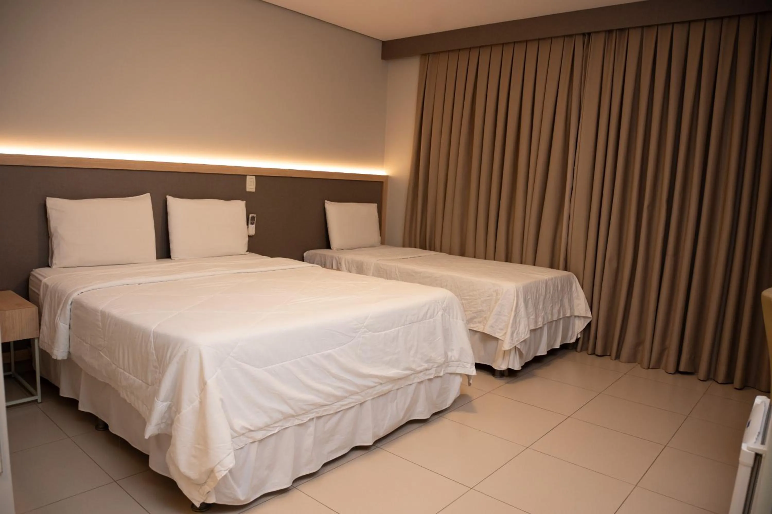 Bed in Golden Plaza Hotel