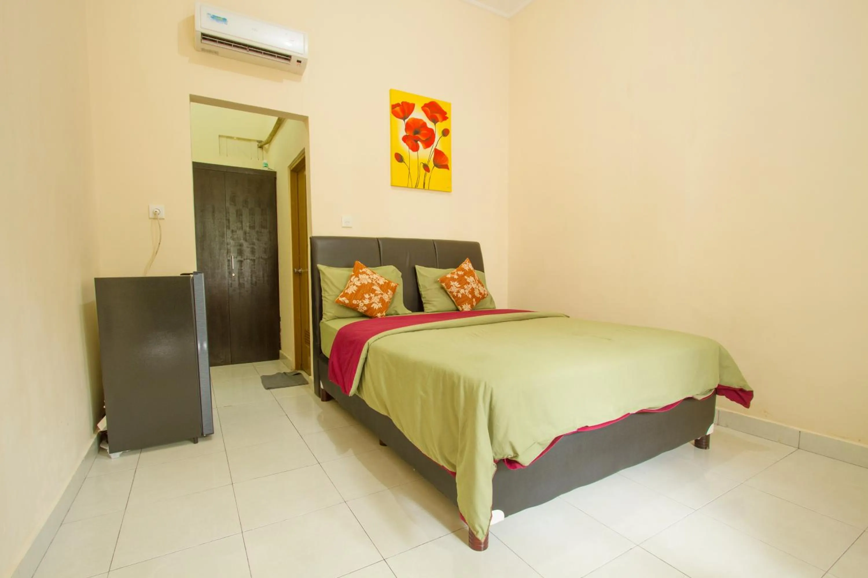 Bed in Seminyak Point Guest House