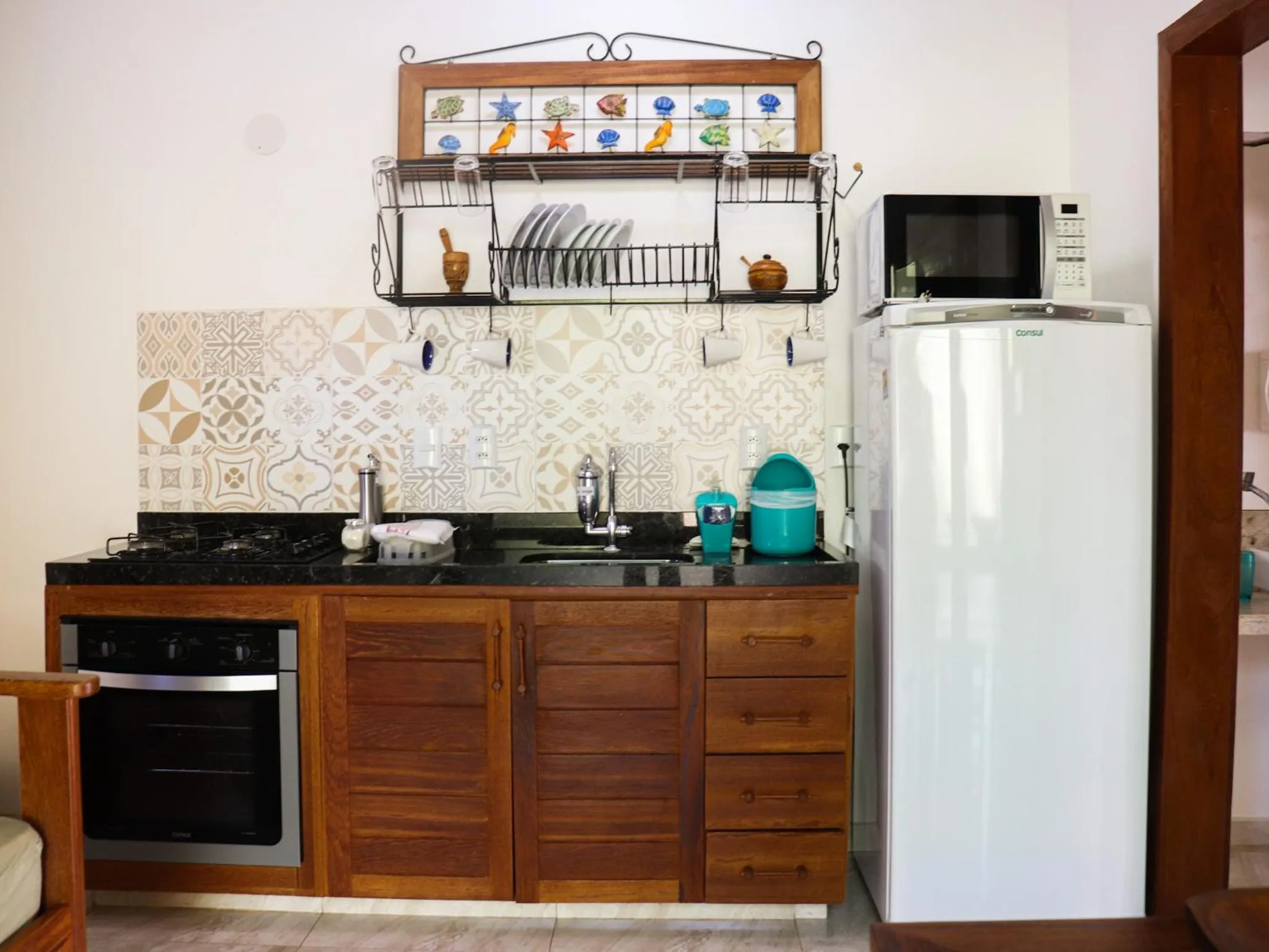 Kitchen or kitchenette in Conchas do Mar Residence