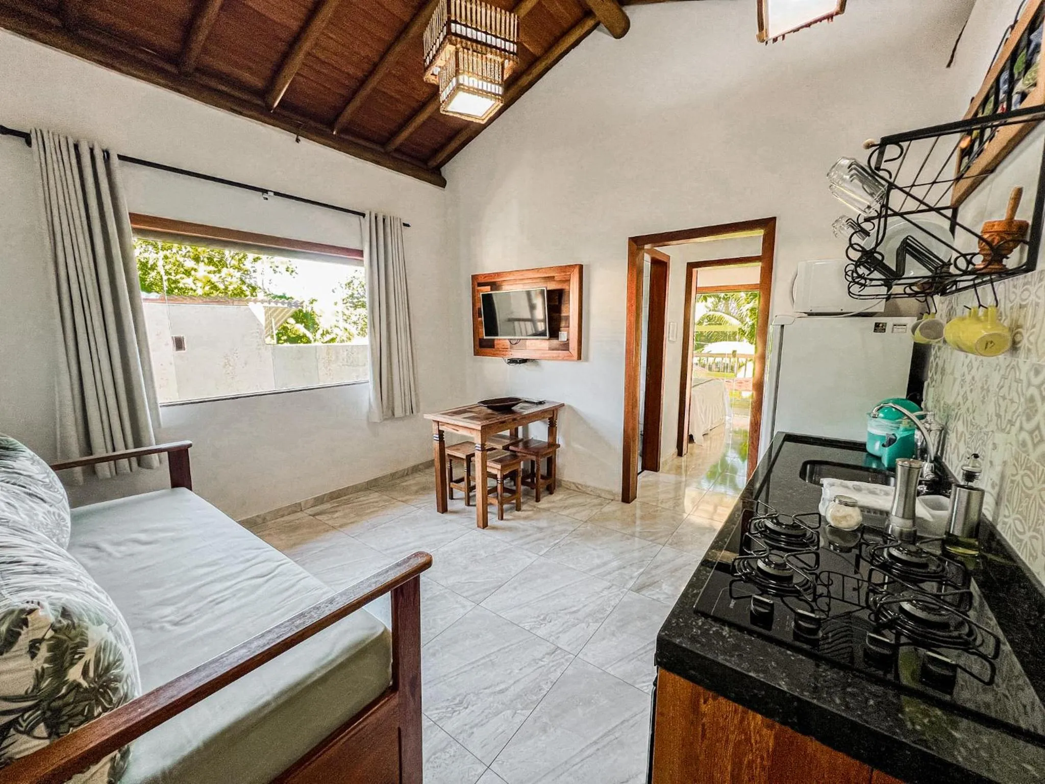 Kitchen or kitchenette, Bed in Conchas do Mar Residence