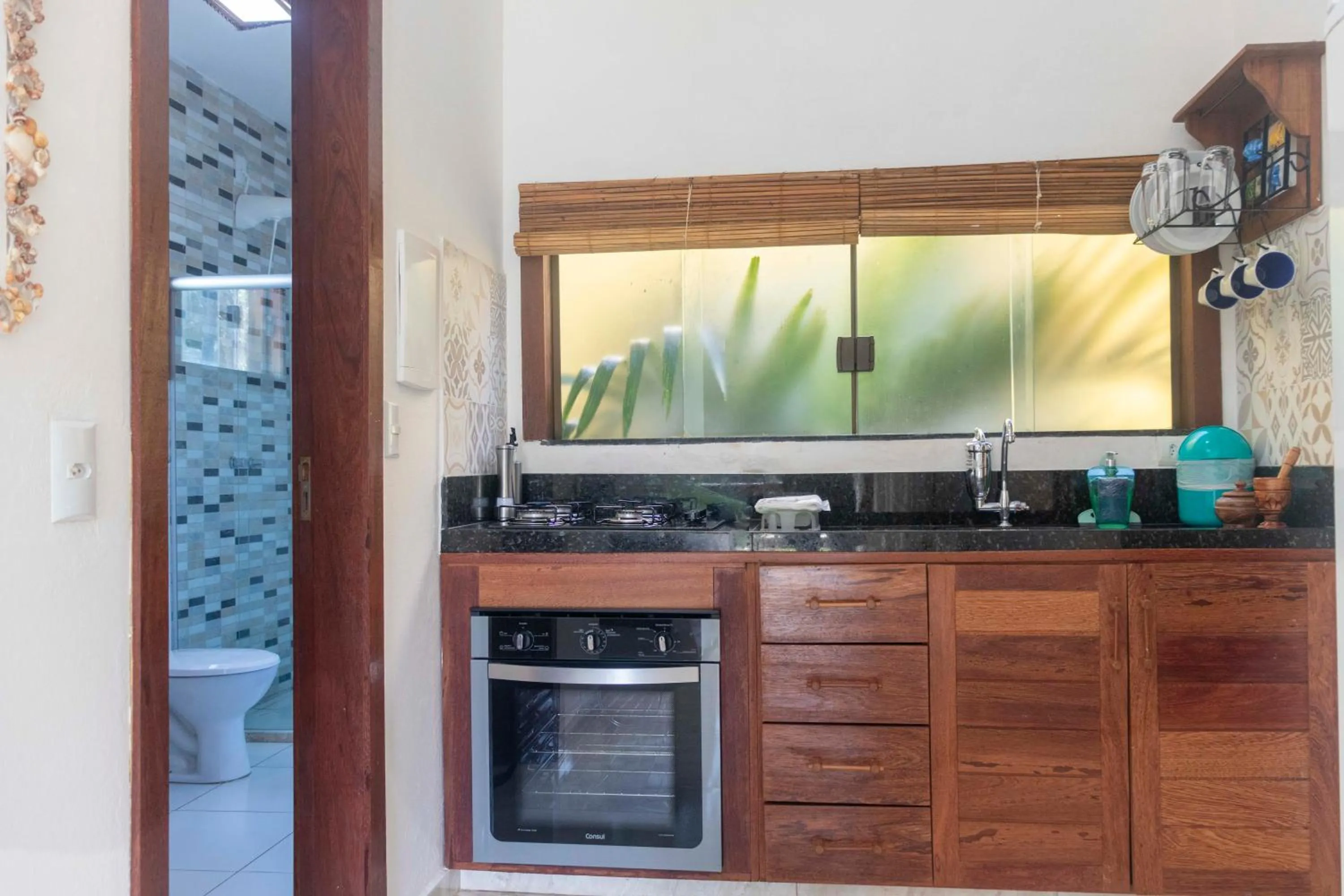 Kitchen or kitchenette in Conchas do Mar Residence