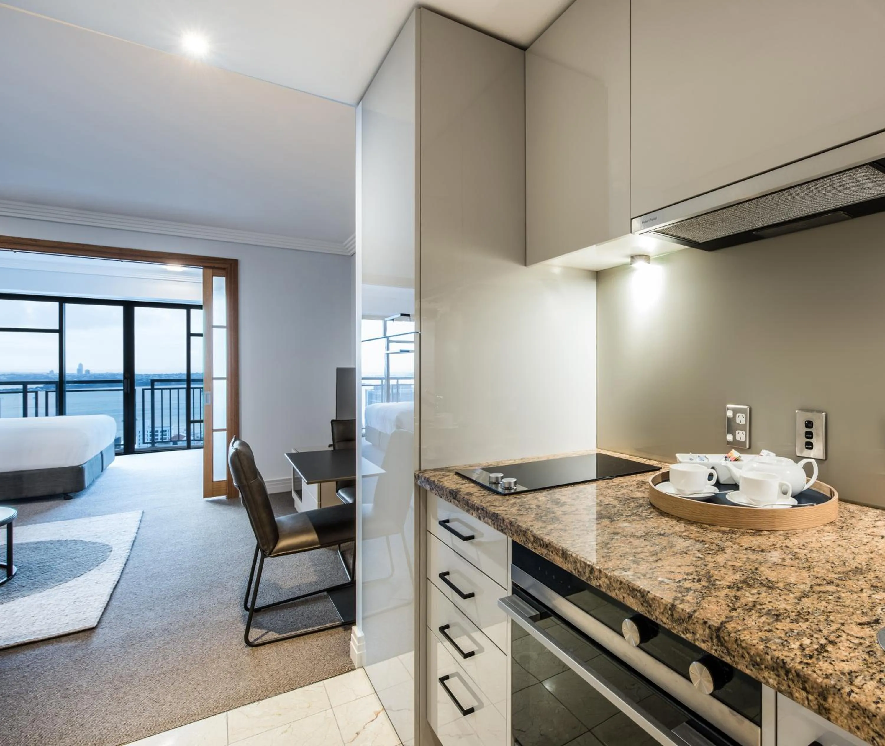 Kitchen or kitchenette, Bed in Avani Metropolis Auckland Residences