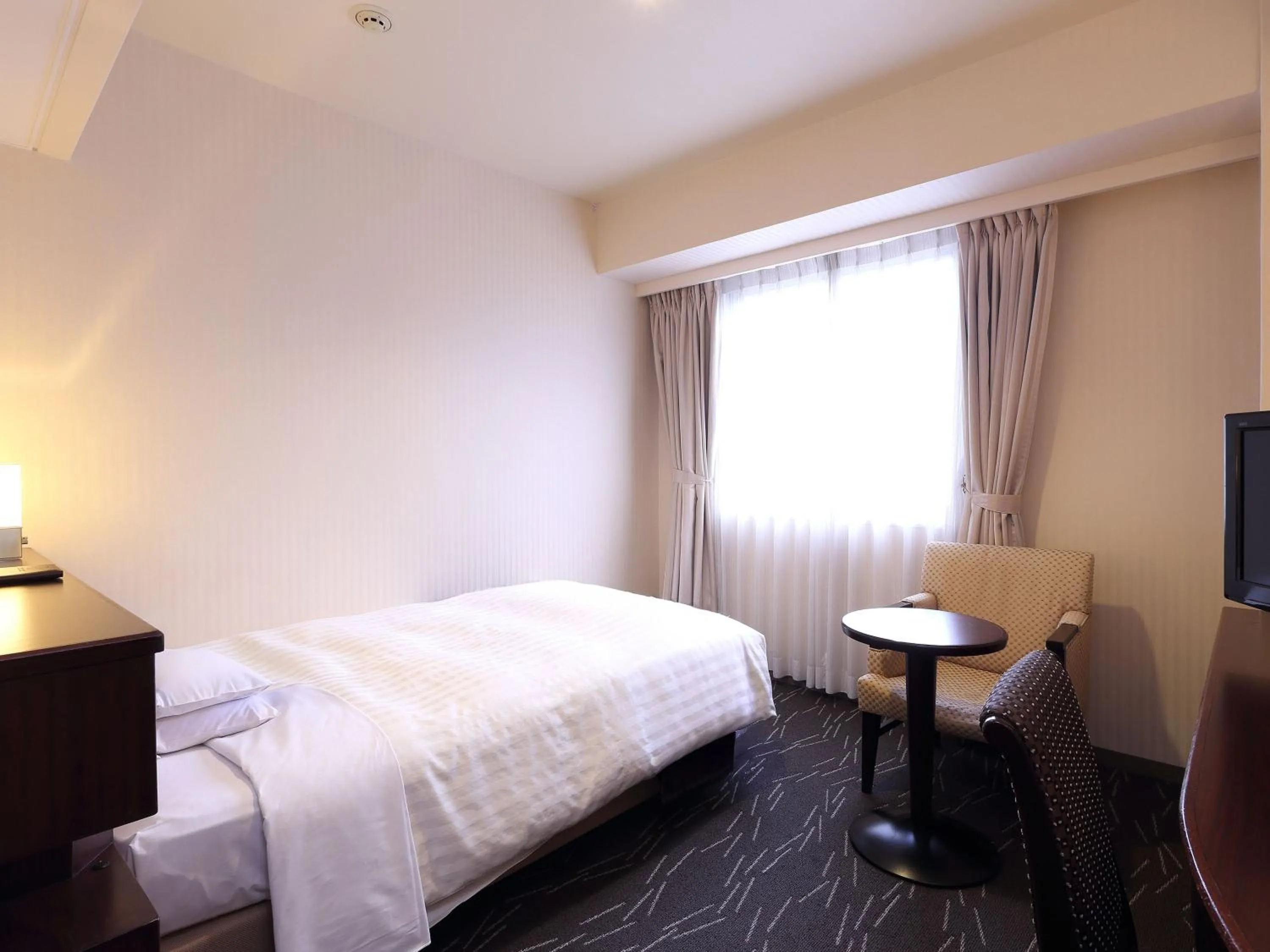 Bedroom, Bed in Nishitetsu Grand Hotel