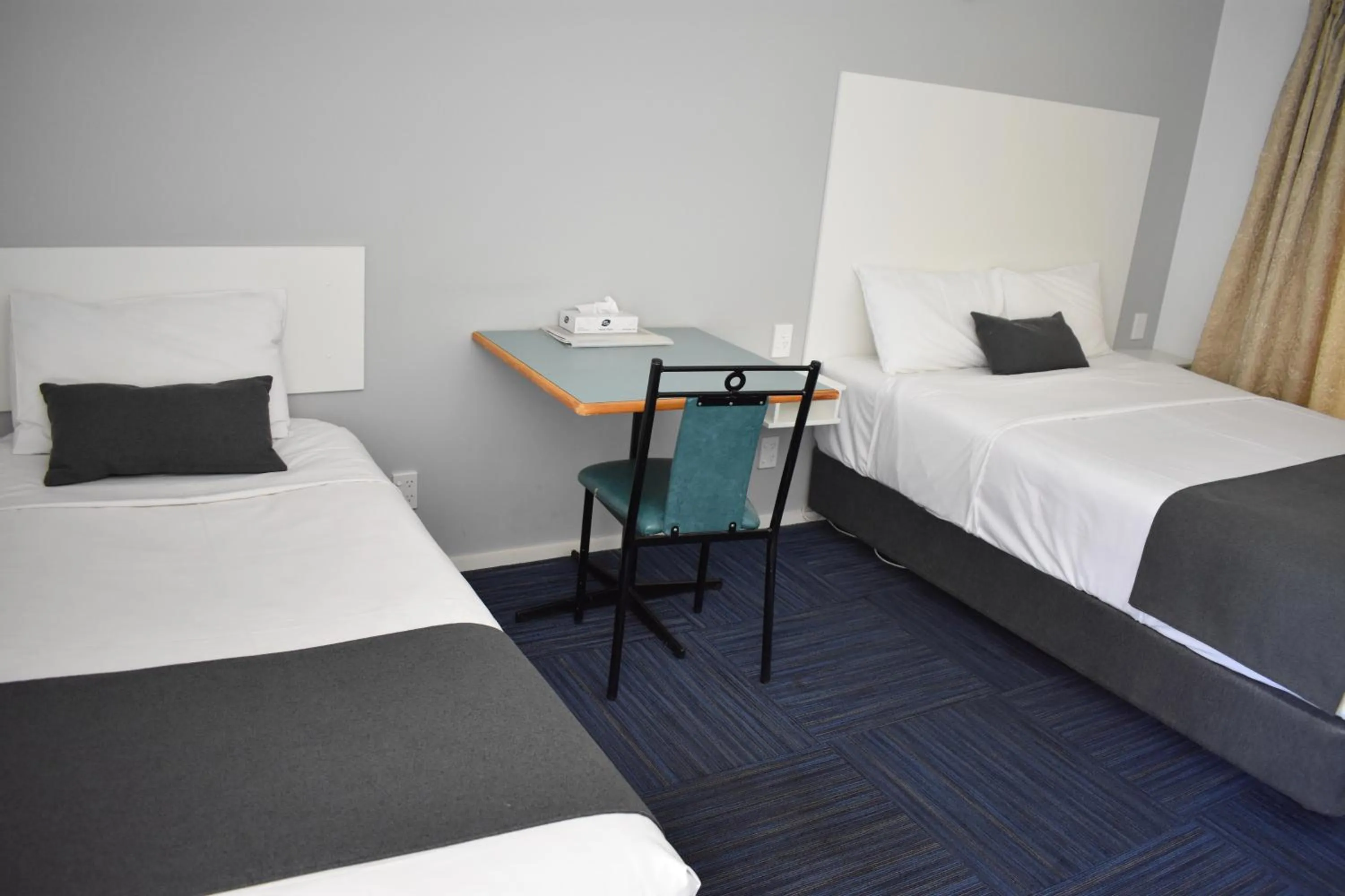 Bed in Riviana Motel