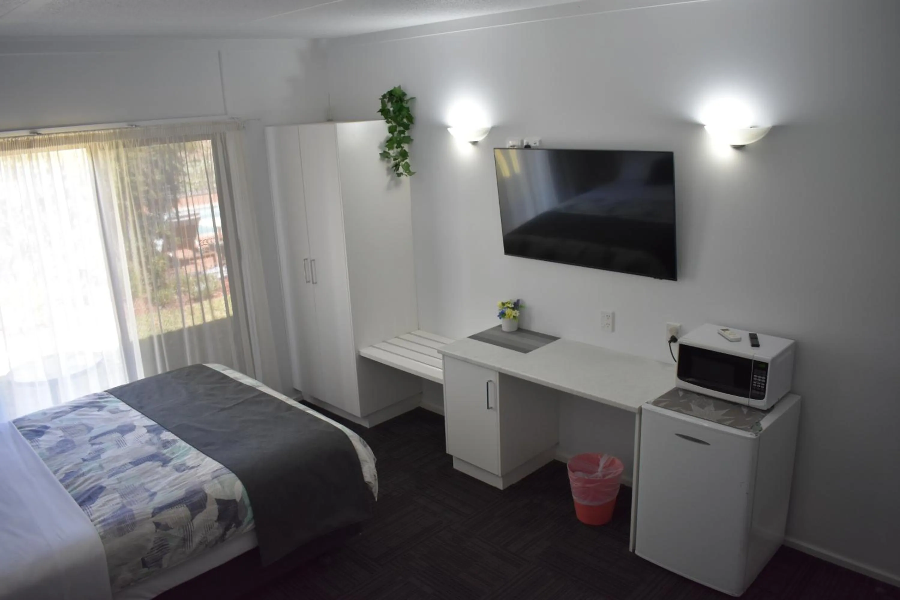 Bed in Riviana Motel