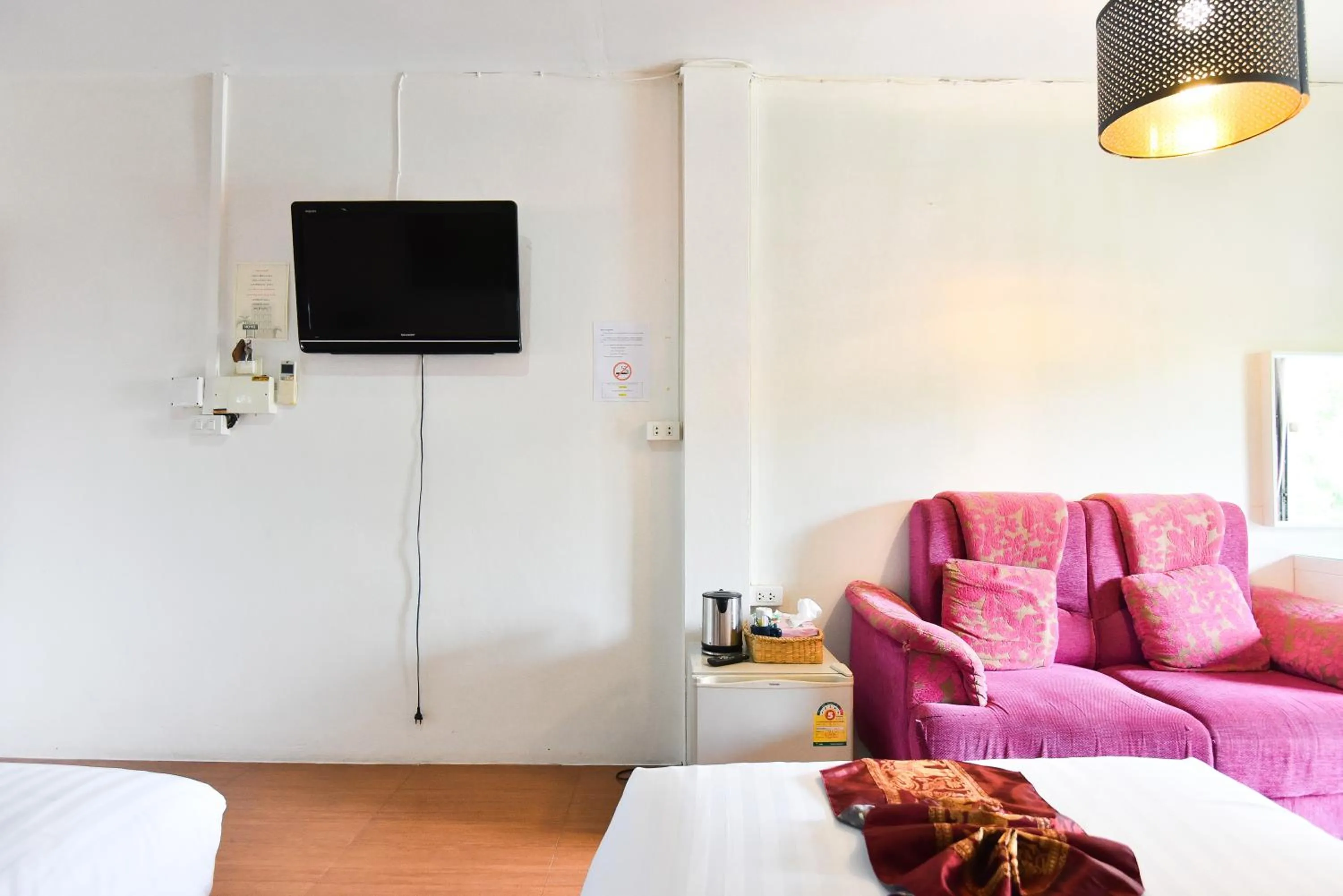 Living room, Bed in P.U. Inn Resort