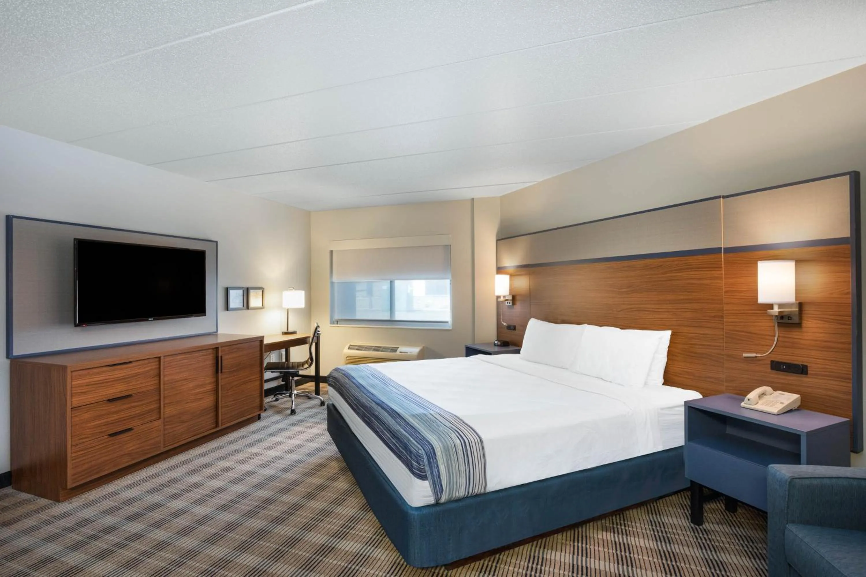 Bed in AmericInn by Wyndham Jackson