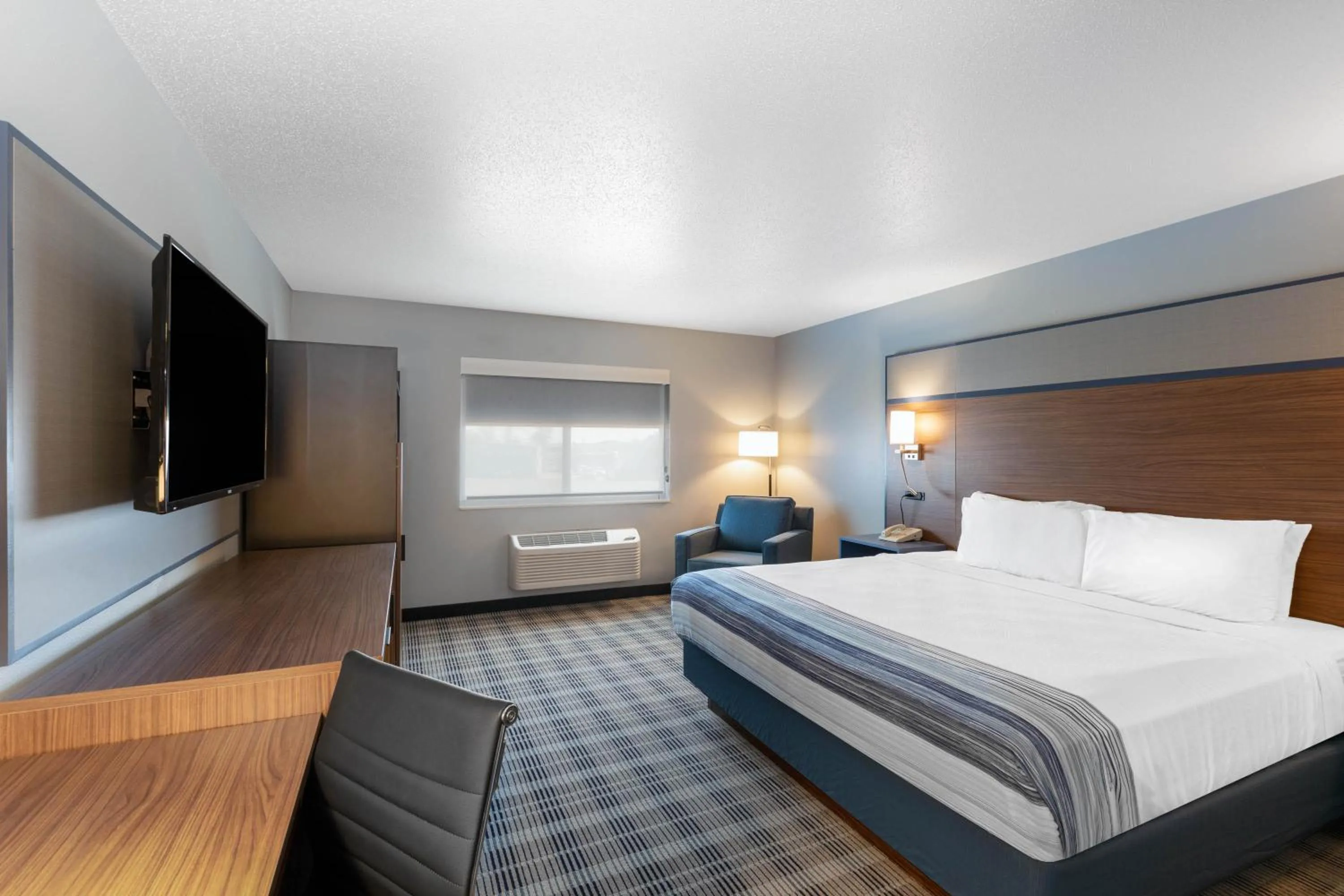 Bed in AmericInn by Wyndham Jackson