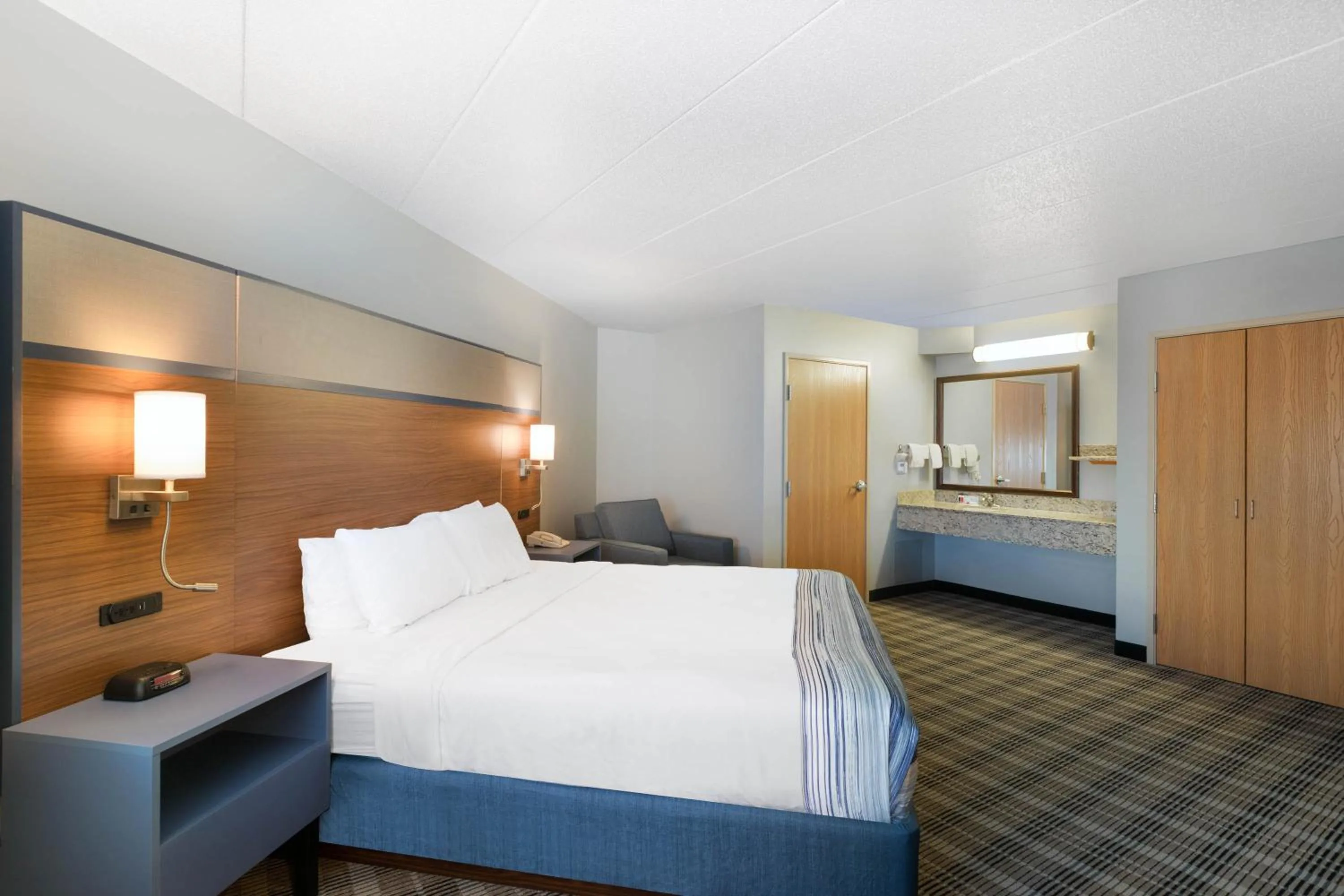 Bed in AmericInn by Wyndham Jackson