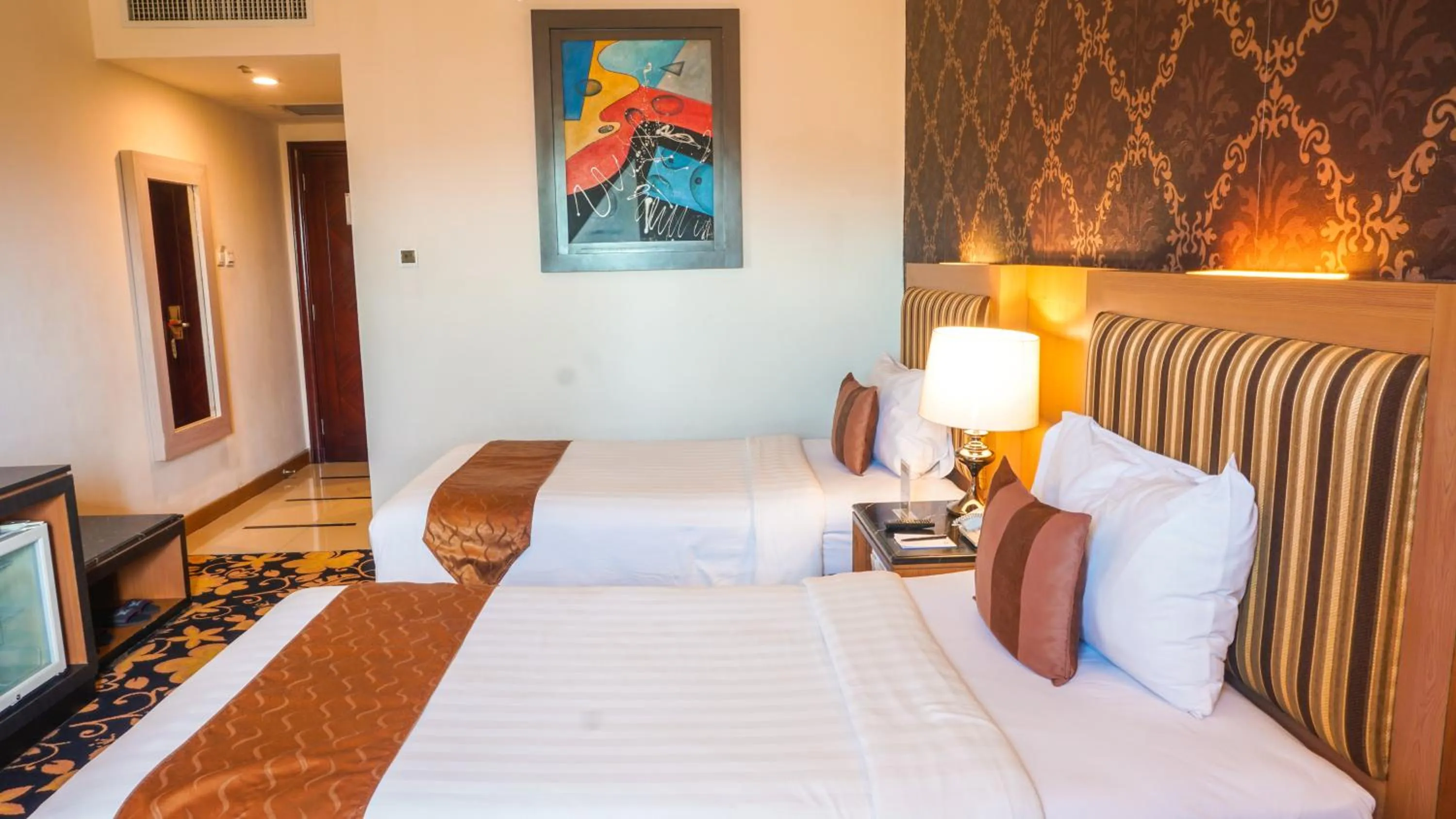 Bed in Grand Rocky Hotel Bukittinggi