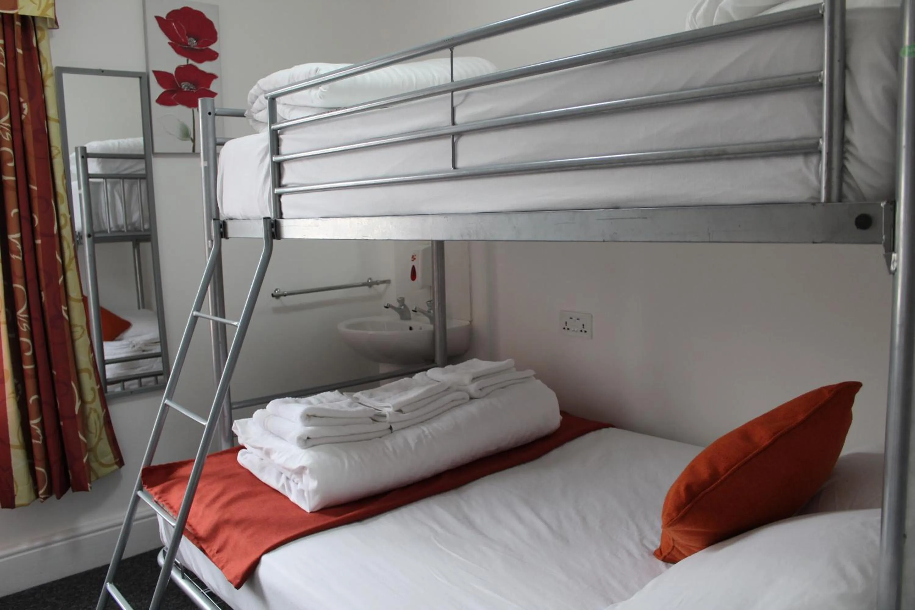 Photo of the whole room, Bed in Backpackers Blackpool Hotel & Suites