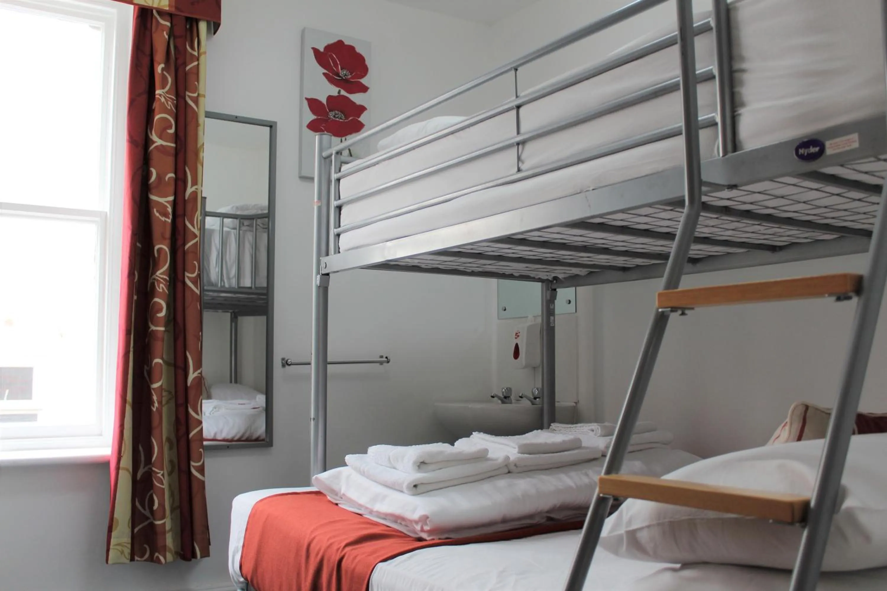 Photo of the whole room, Bed in Backpackers Blackpool Hotel & Suites