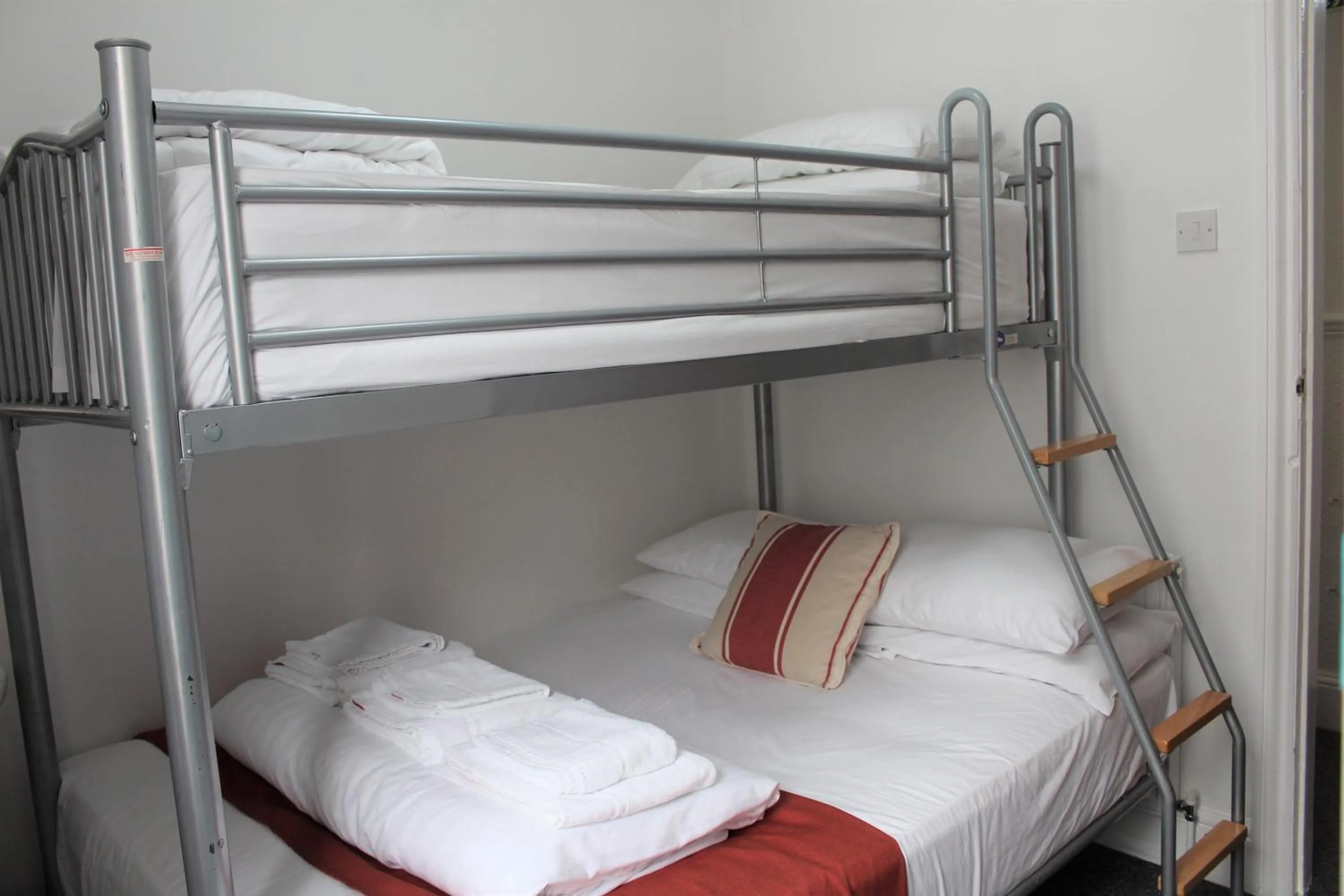 Photo of the whole room, Bed in Backpackers Blackpool Hotel & Suites