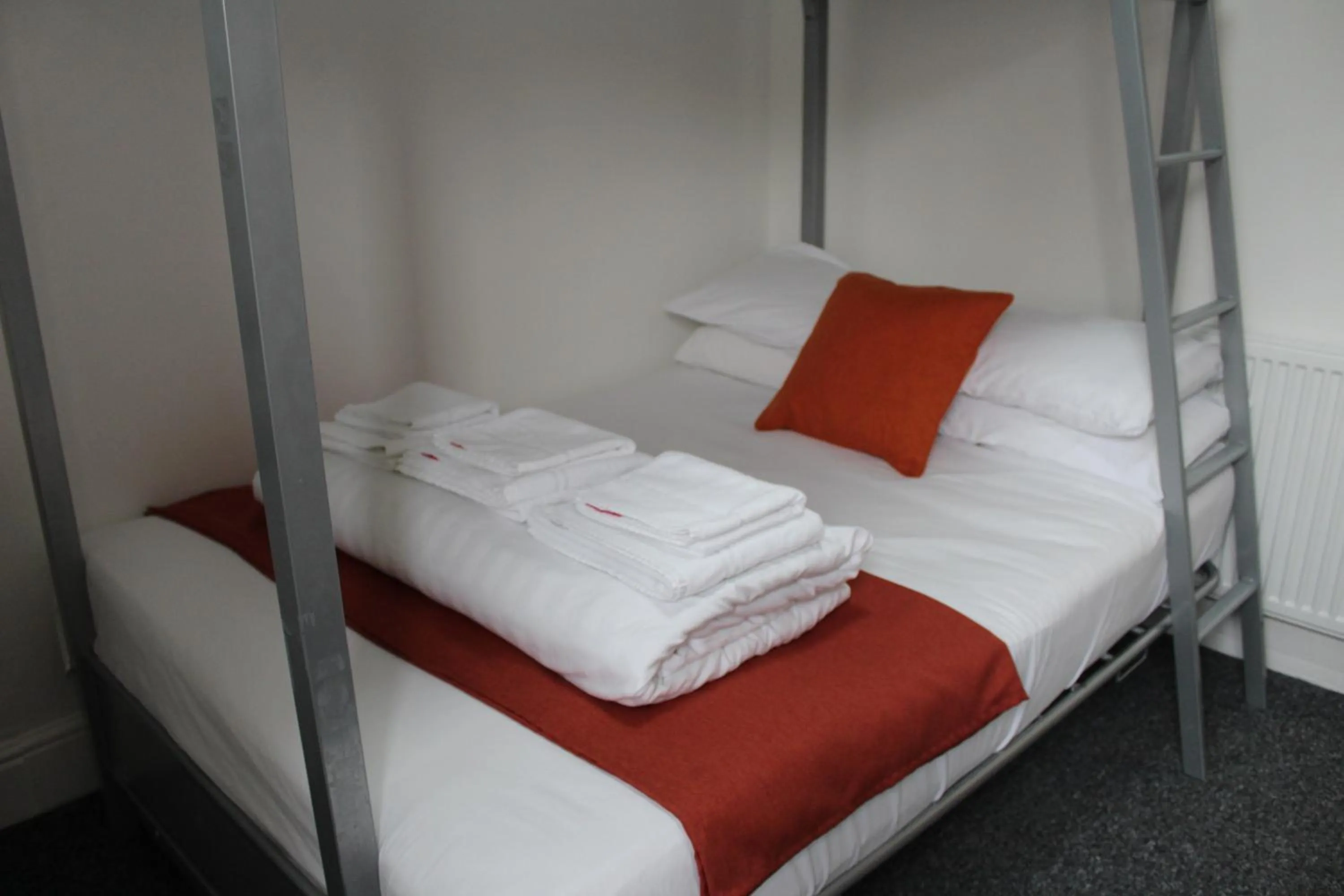 Photo of the whole room, Bed in Backpackers Blackpool Hotel & Suites