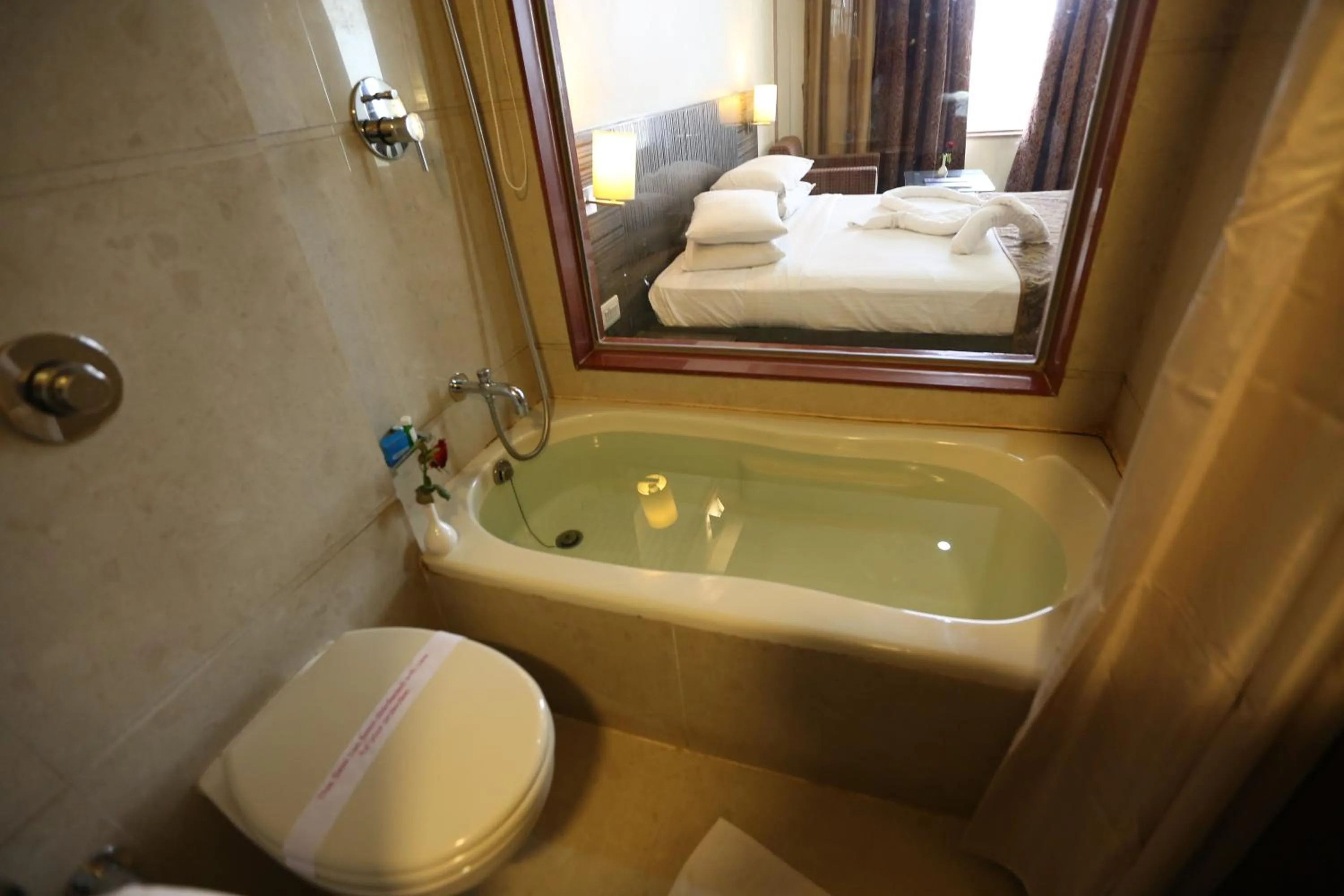 Bathroom, Bed in SilverCloud Hotel and Banquets
