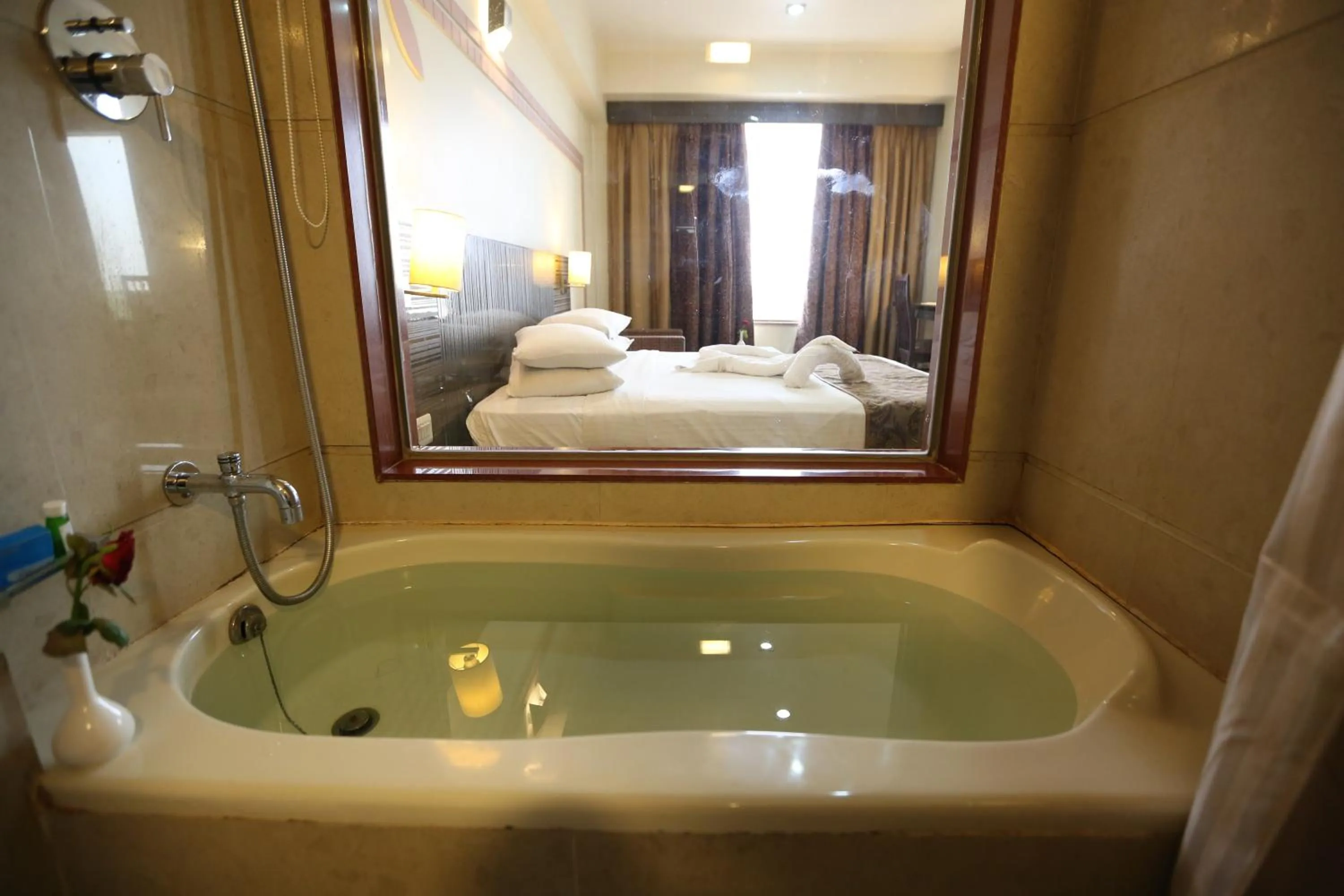 Bathroom, Bed in SilverCloud Hotel and Banquets