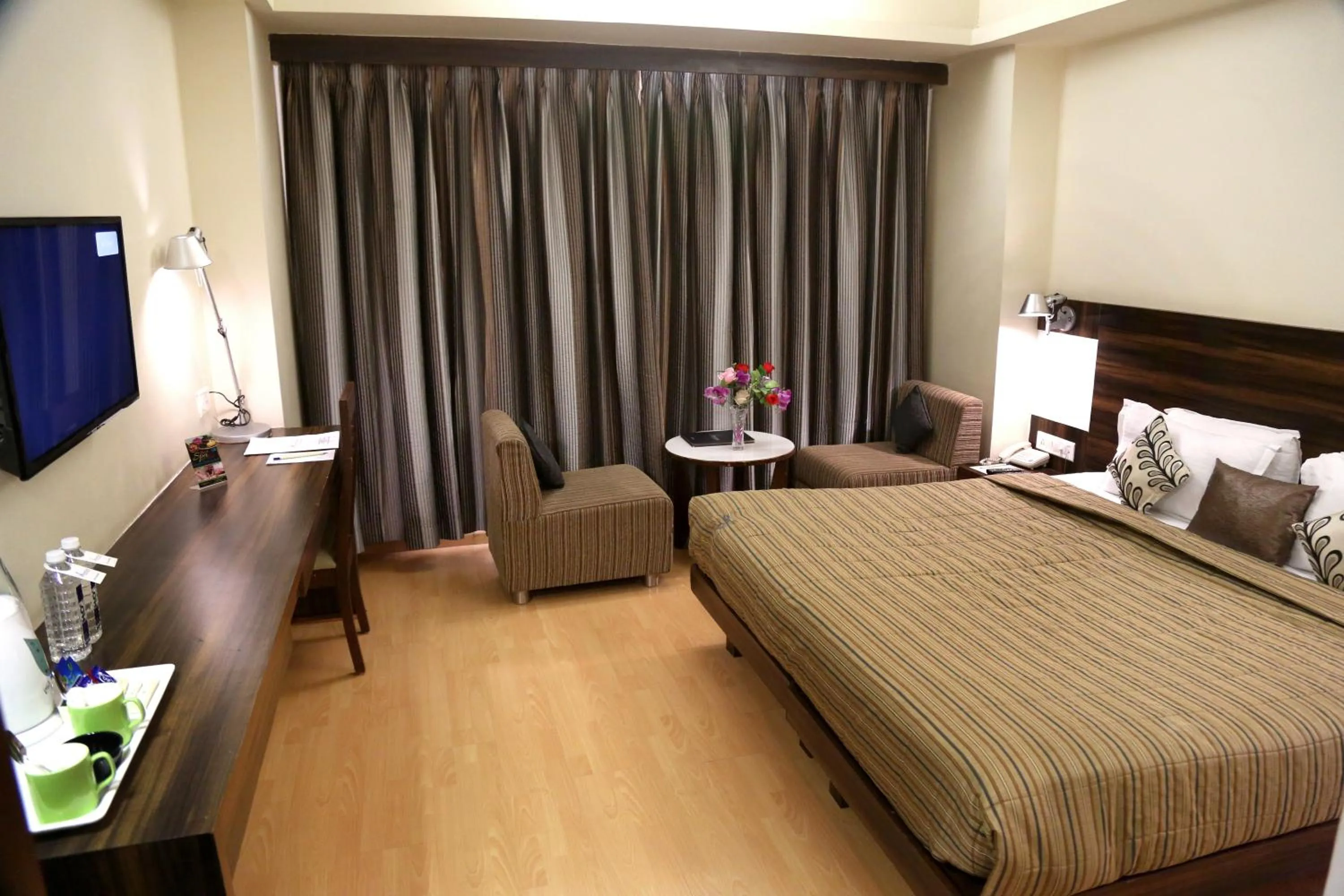 Bed in SilverCloud Hotel and Banquets