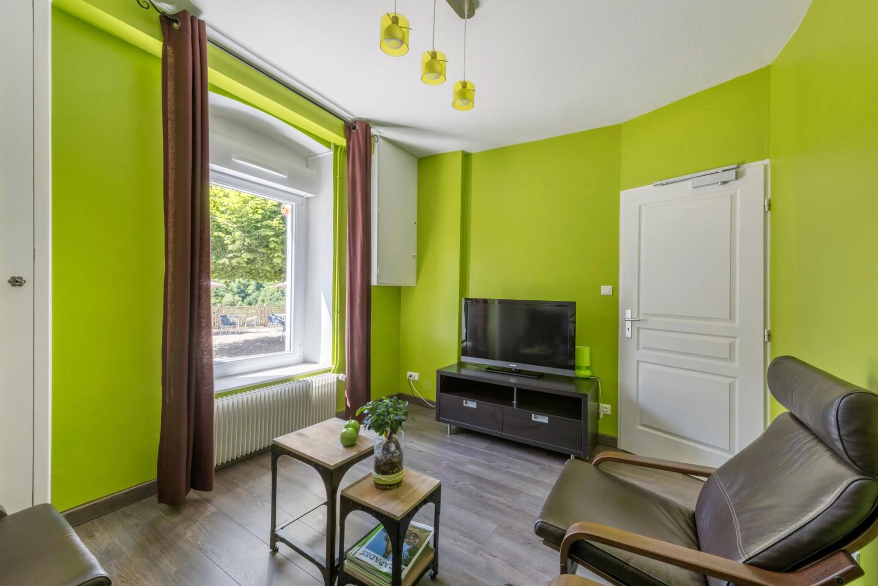 Communal lounge/ TV room in Hôtel De La Plage